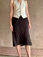 woman wearing Vanessa Bruno midi skirt semi-sheer jacquard black-on-black plaid delicate eyelet and pintucking