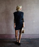 Mature woman wearing the Dorotea dress by Vanessa Bruno with boatneck blouson top fitted skirt in navy blue