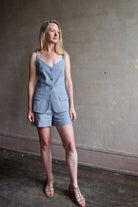 Woman wearing the Vanessa Bruno Elai Top and matching shorts for timeless sihlouette in a blue and white pinestripe