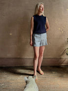 Woman wearing Vanessa Bruno Elisam elevated mid-rise tailored blue and white pinstripe short naturally breathable 