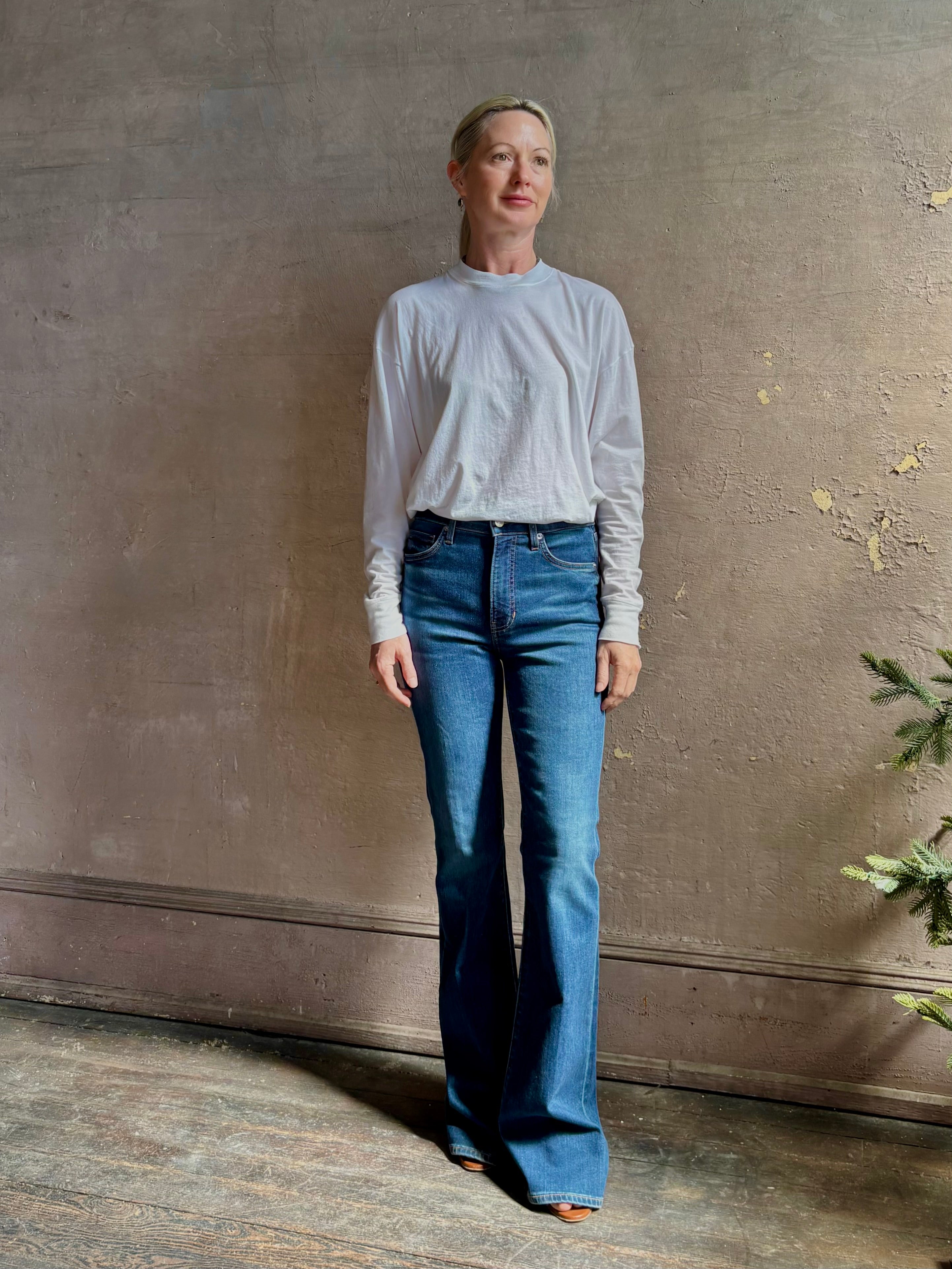 Mature woman wearing VERONICA BEARD BEVERLY JEANS medium wash| Women's Cotton Blend High-Rise Flared Leg