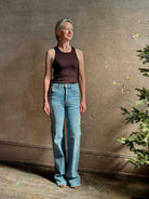 Mature woman wearing American-Made Veronica Beard Crosby Denim High Rise Straight Leg Jean Stretch Medium Wash