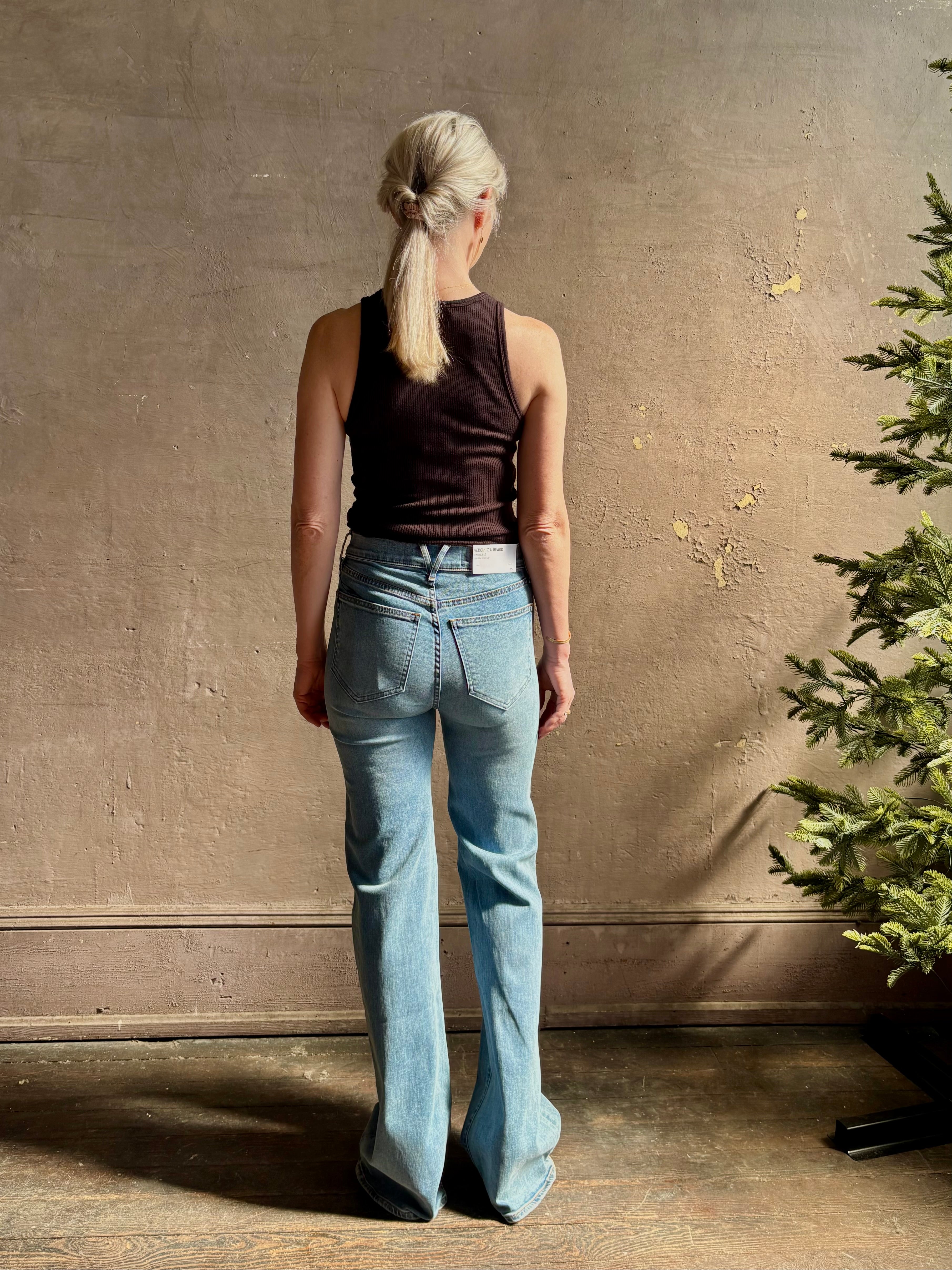 Mature woman wearing American-Made Veronica Beard Crosby Denim High Rise Straight Leg Jean Stretch Medium Wash