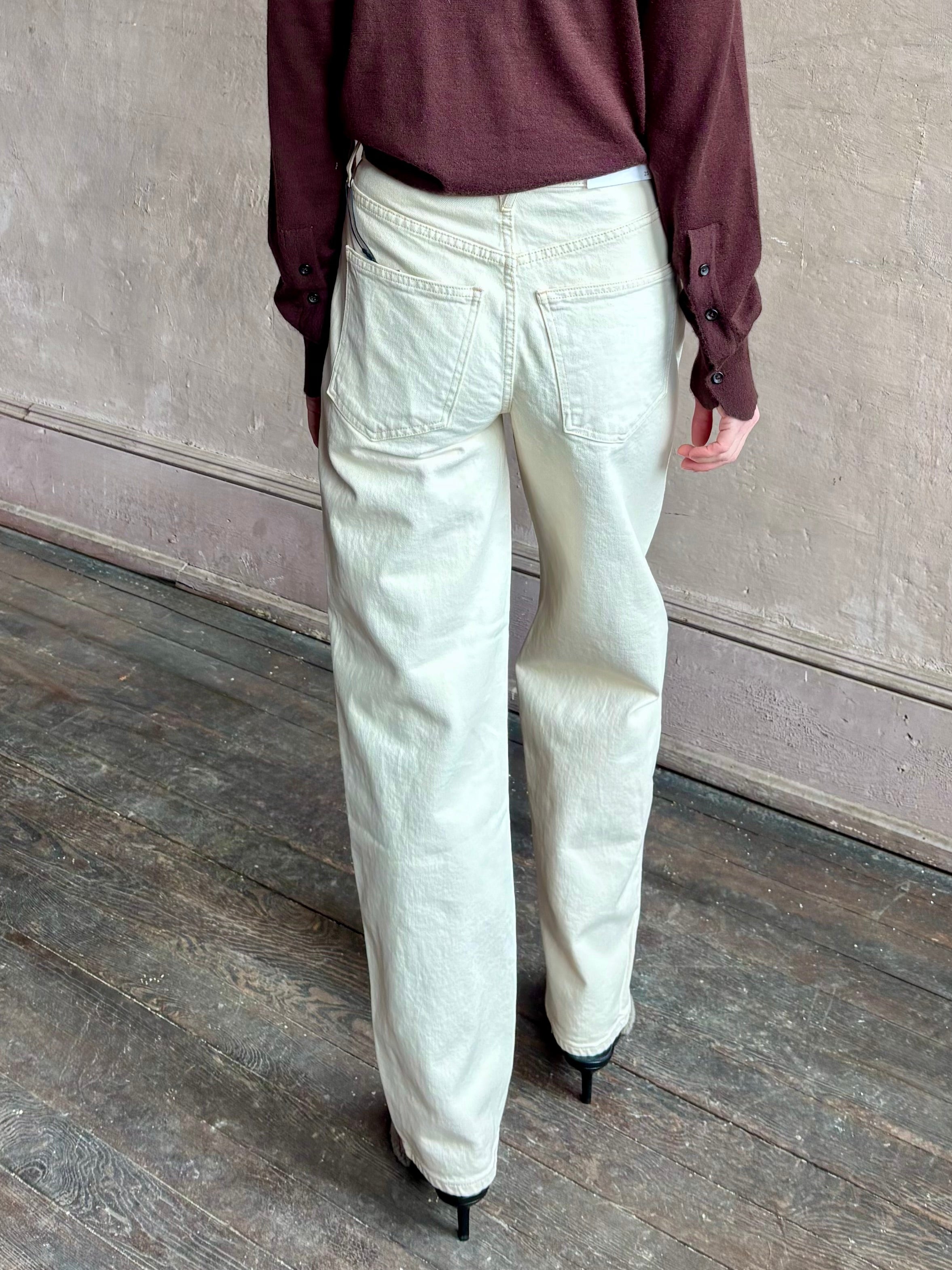 Image of woman wearing VERONICA BEARD Harley Arc Leg Jean in Ecru with Premium Cotton denim made in American for ultimate casual elegance