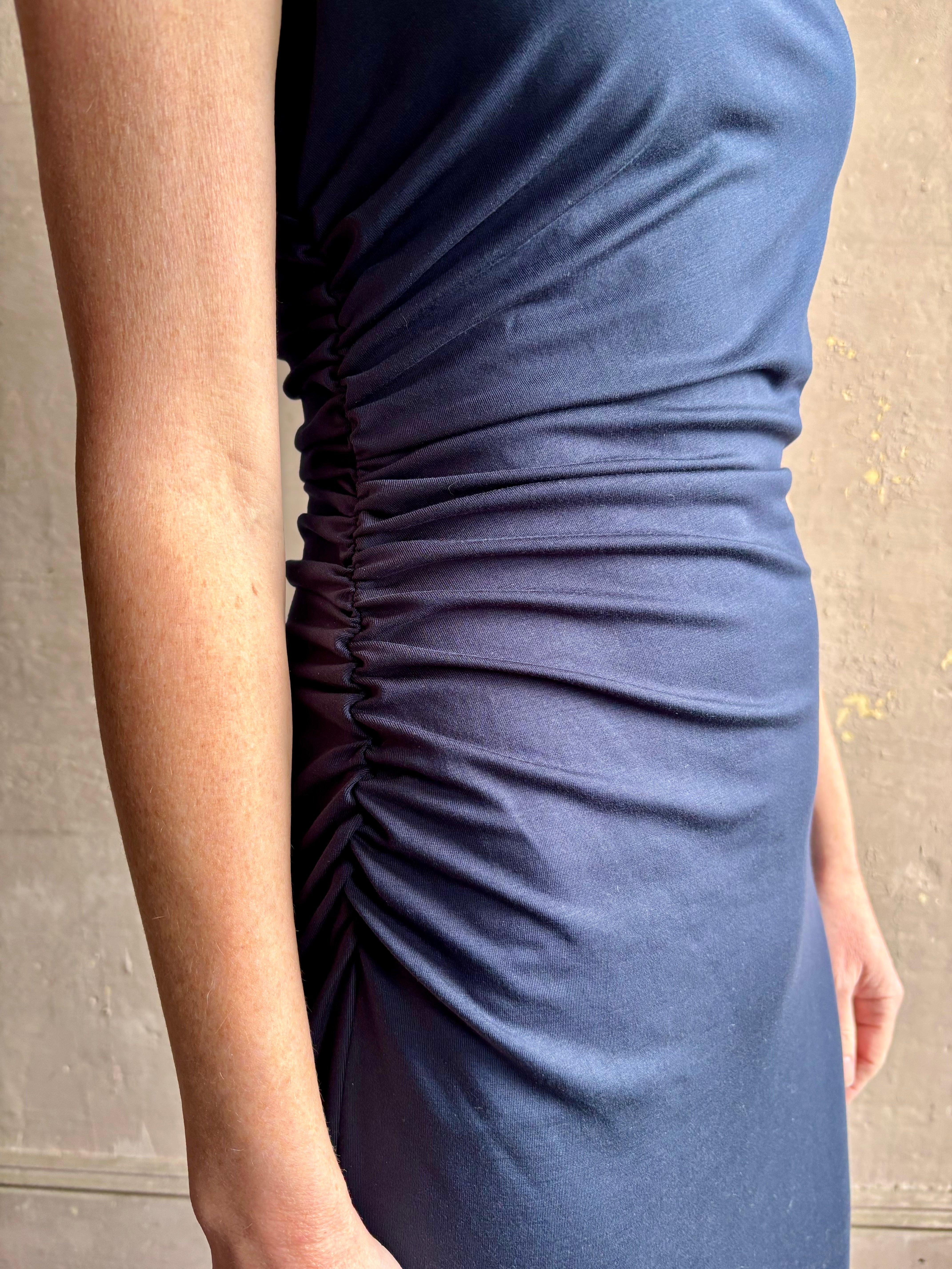 Image of mature woman wearing VERONICA BEARD Kerilyn navy blue maxi sheath Dress with side rushing for a flattering fit