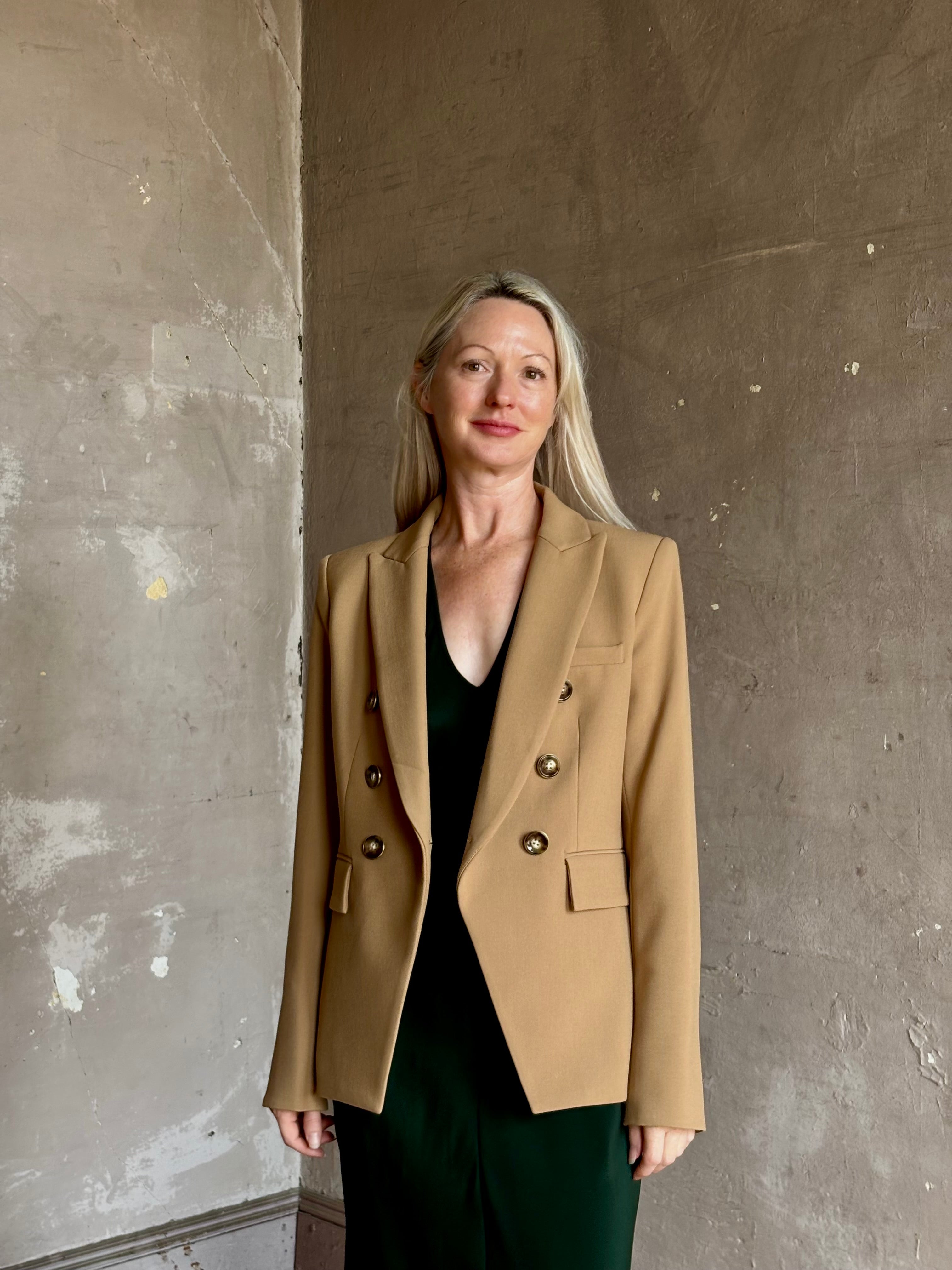 Mature woman wearing Veronica Beard Miller Dickey Jacket in Heritage Khaki tailored blazer flattering back darts