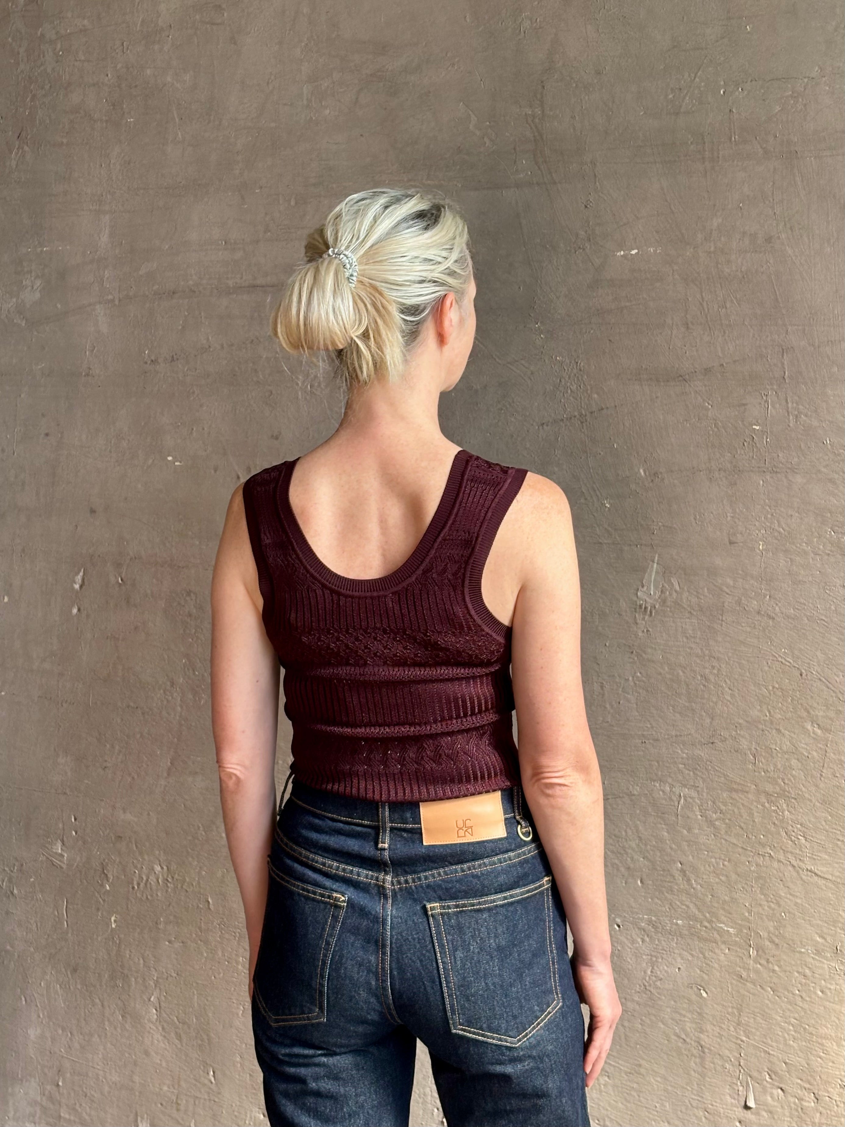 Sandra Tank from Veronica Beard rendered in a rich mulberry tone with detailed weaved and scoop back