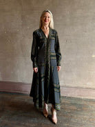 Woman wearing Veronica Beard's Skye Dress in New Navy Multi silk-blend A-line cuffed sleeves asymmetrical hem