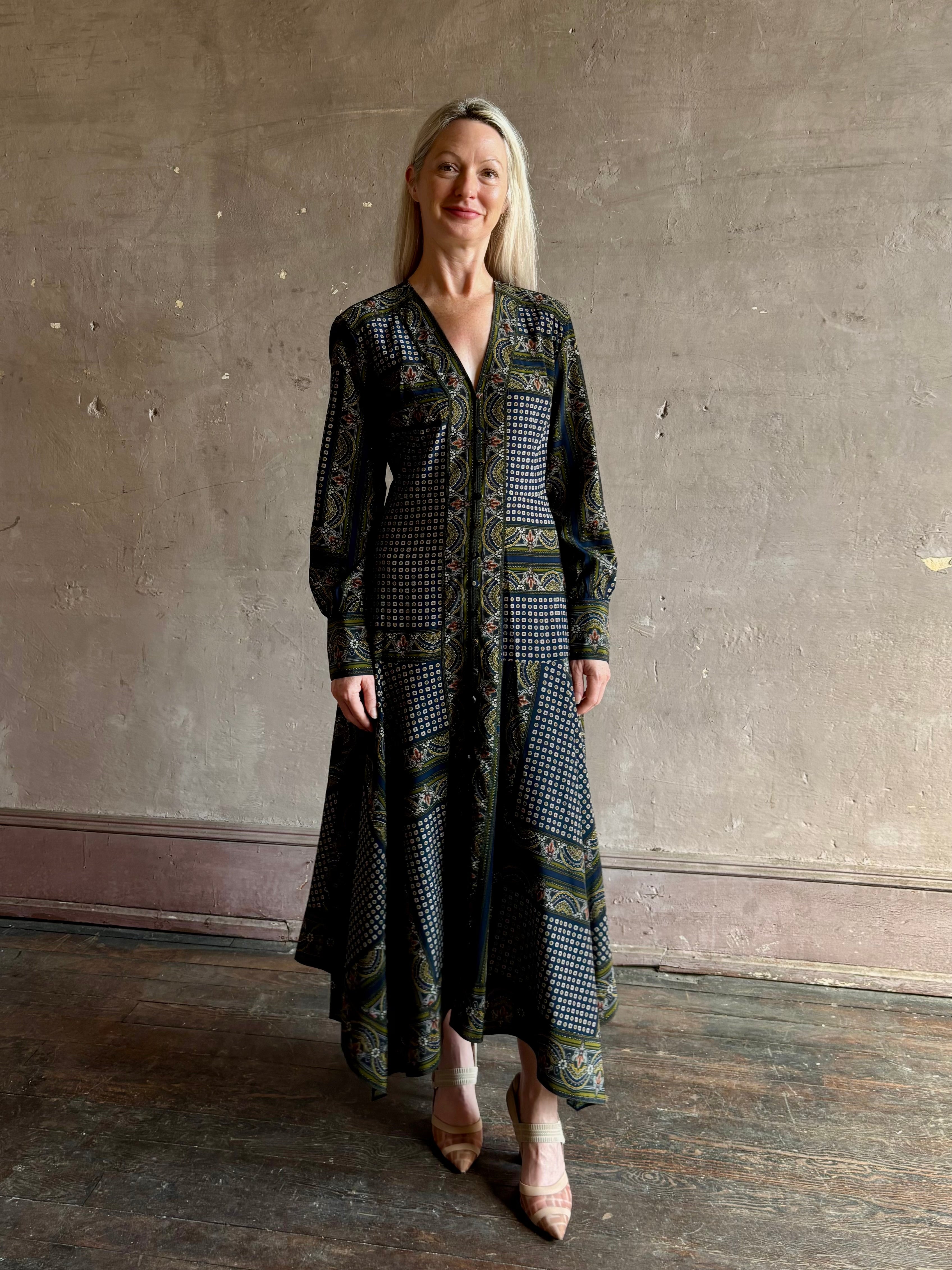 Woman wearing Veronica Beard's Skye Dress in New Navy Multi silk-blend A-line cuffed sleeves asymmetrical hem