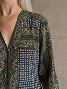 Mature woman wearing Veronica Beard's Skye Dress Navy yellow and green paisley print long sleeves and v-neck