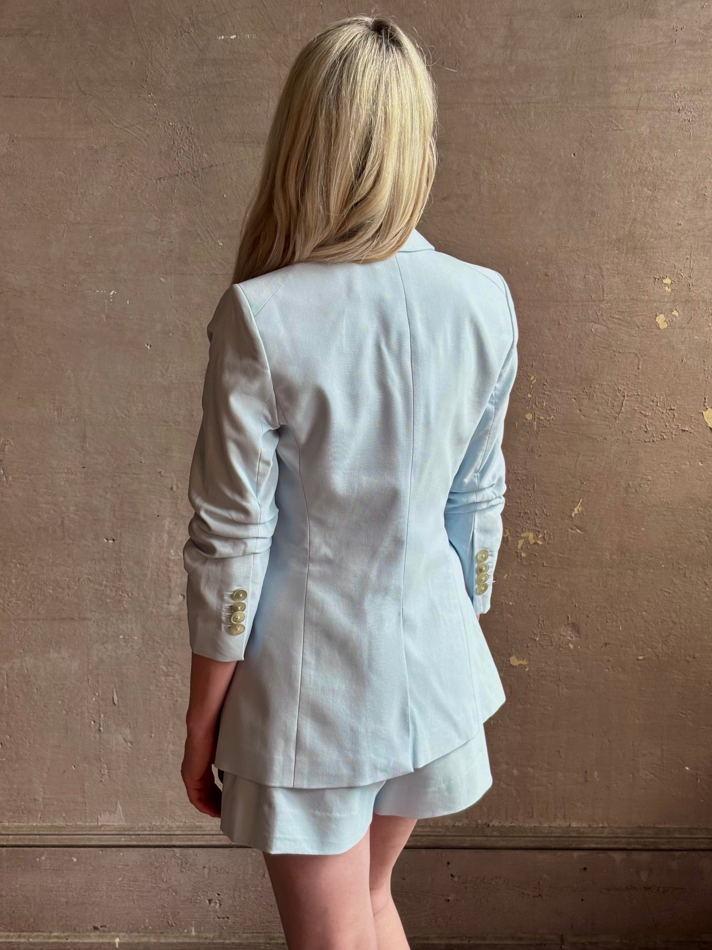Mature woman wearing tailored Veronica Beard Tomi Dickey Jacket with button front optional  zip in accessories cupro lining