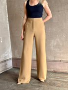 Woman wearing Veronica Beard Tonelli Pant Heritage Khaki flat-front beltless tailored trouser made in America