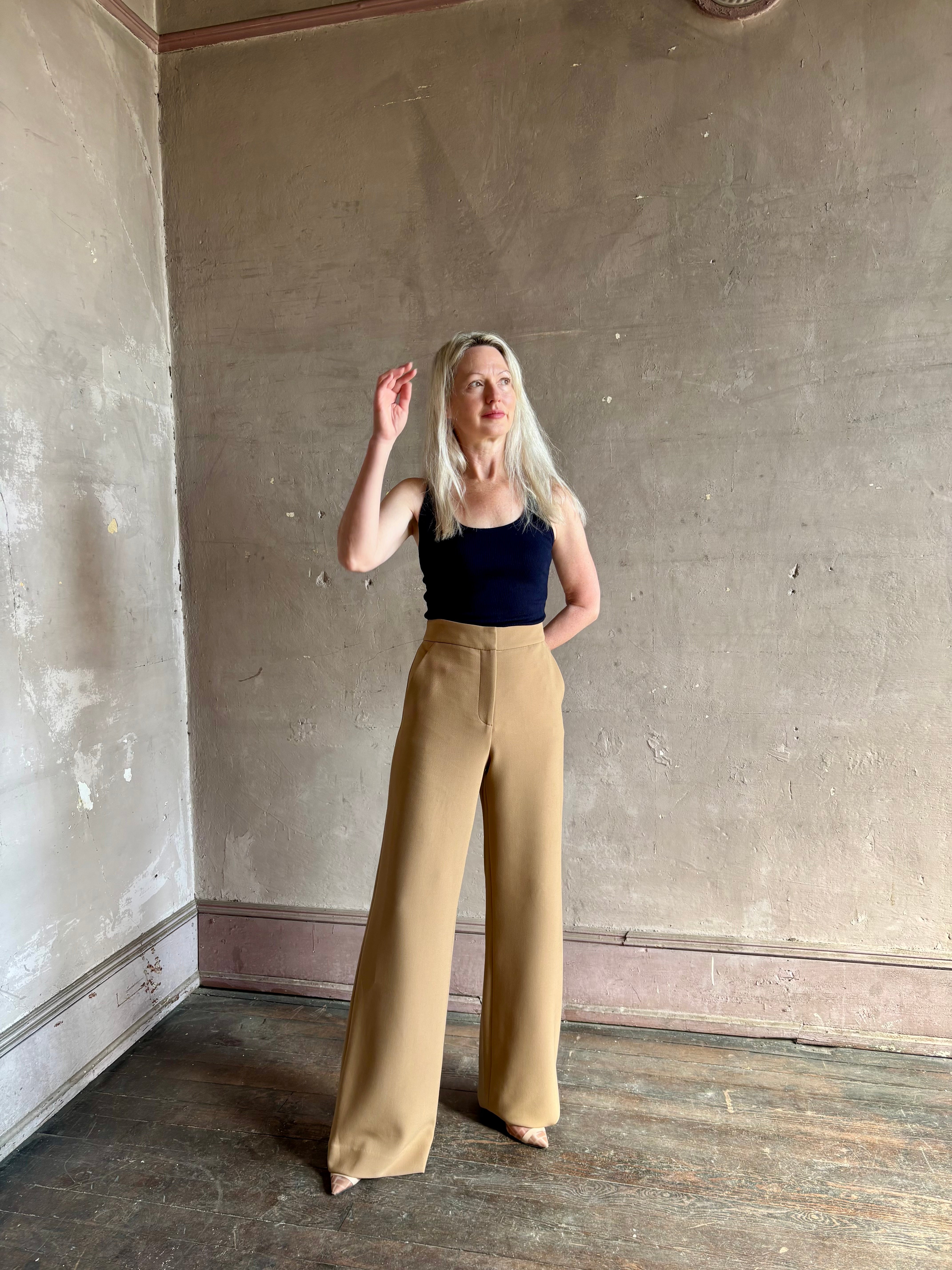 Woman wearing Veronica Beard Tonelli Pant Heritage Khaki flat-front beltless tailored trouser made in America
