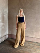 Woman wearing Veronica Beard Tonelli Pant Heritage Khaki flat-front beltless tailored trouser made in America