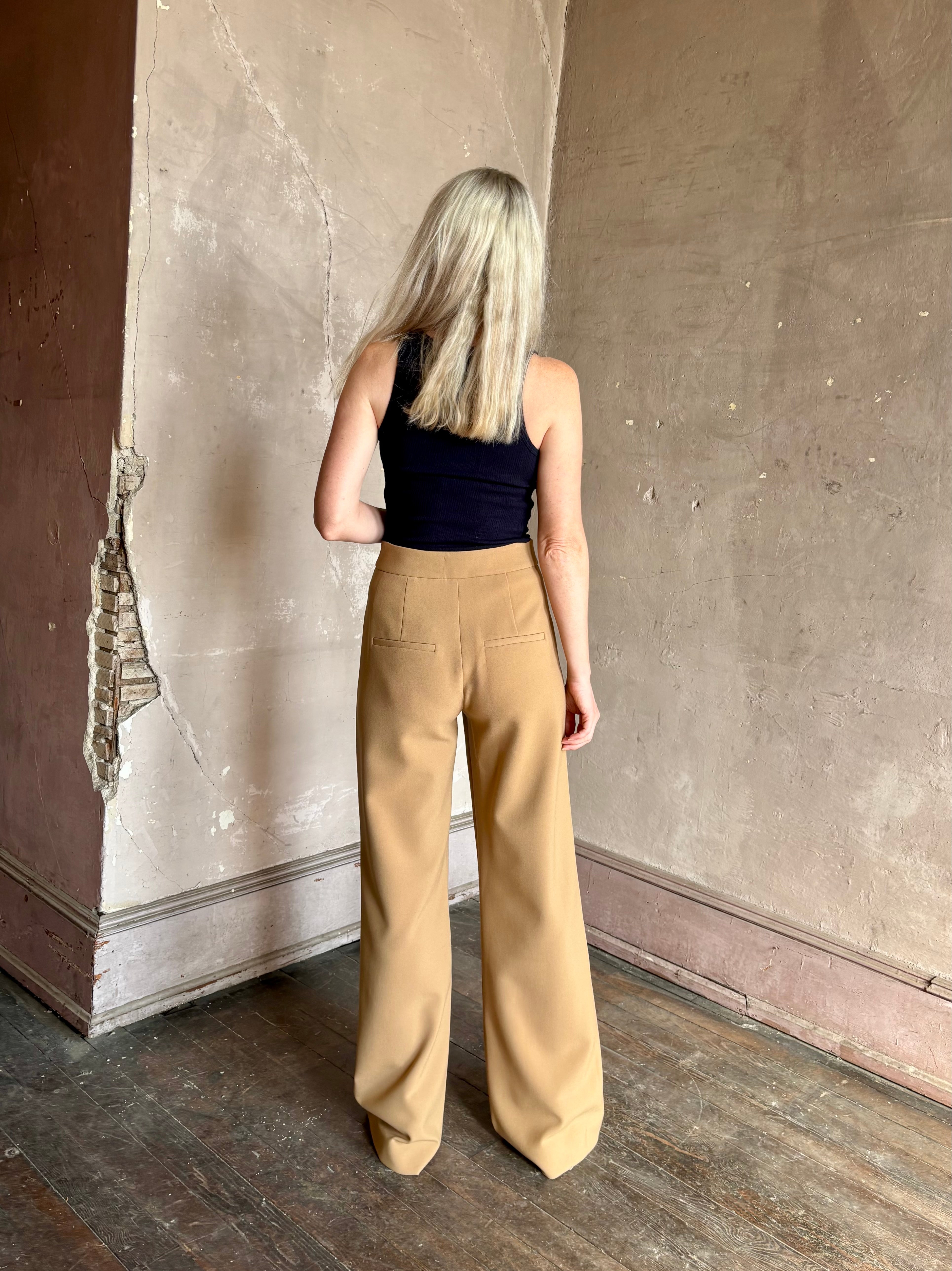 Woman wearing Veronica Beard Tonelli Pant Heritage Khaki flat-front beltless tailored trouser made in America