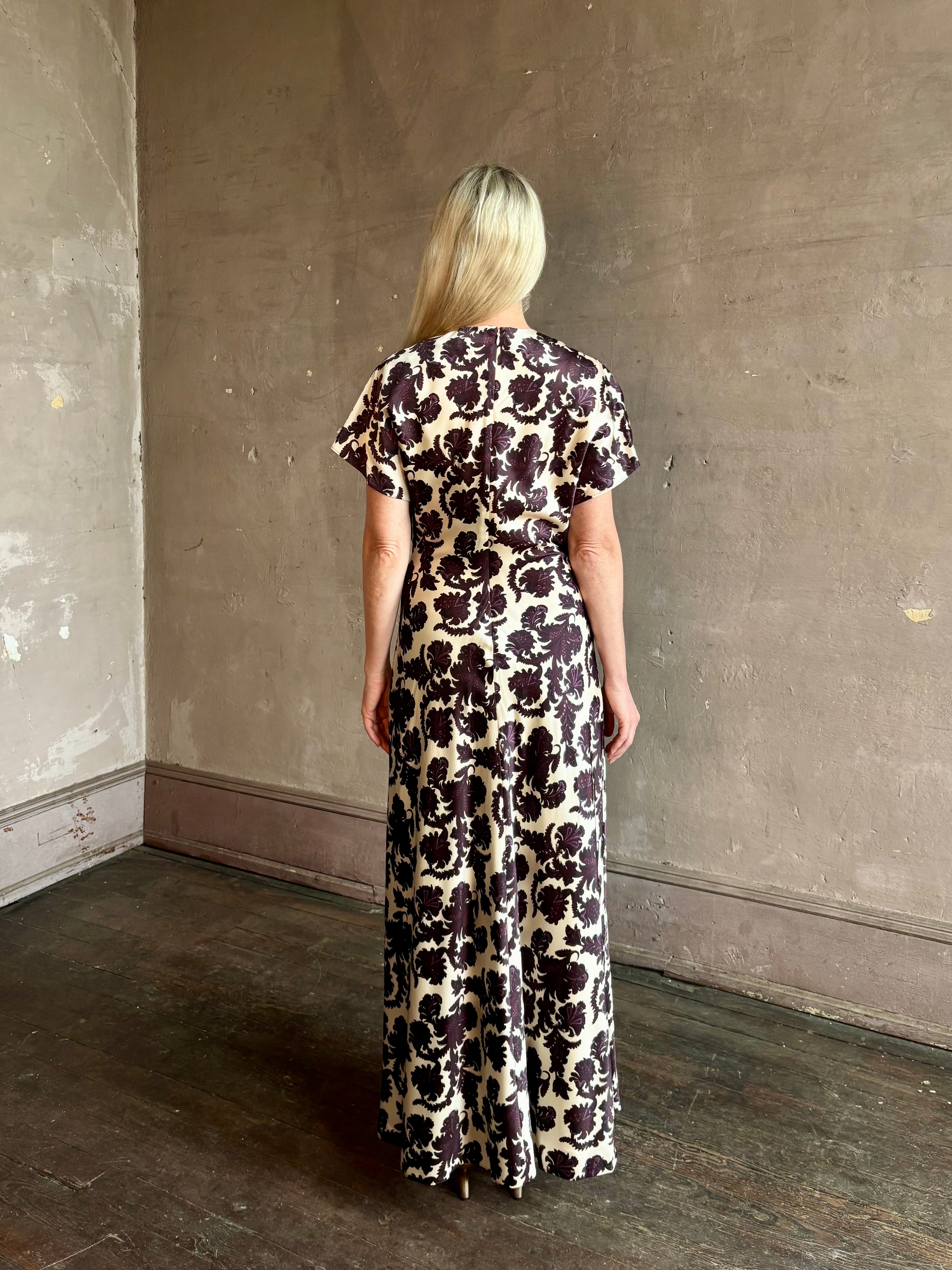 Mature woman wearing designer Veronica Beard V-Neck Redgrave Dress Ecru Multi short sleeves sheath maxi occasion-ready 