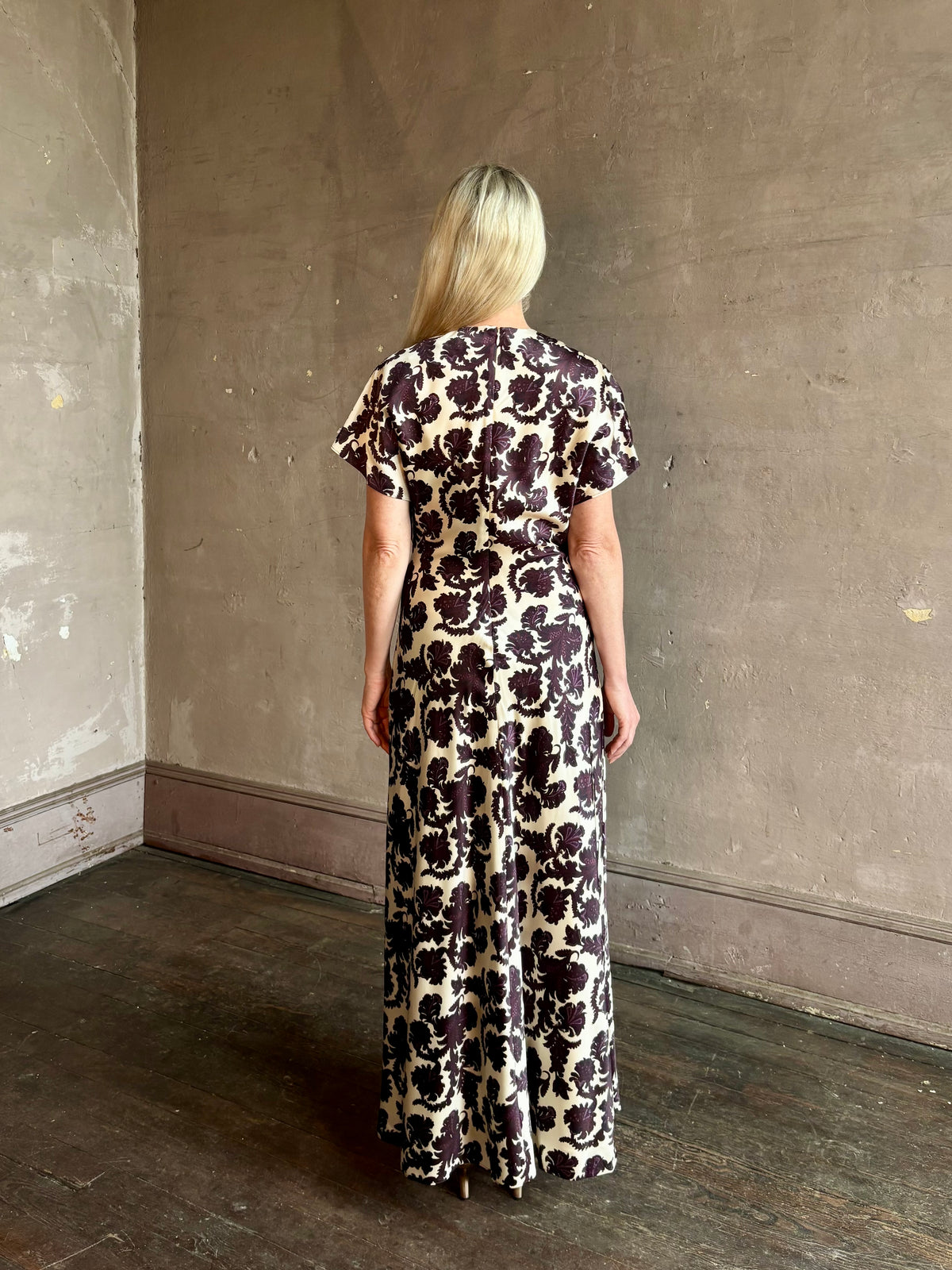 Mature woman wearing designer Veronica Beard V-Neck Redgrave Dress Ecru Multi short sleeves sheath maxi occasion-ready 