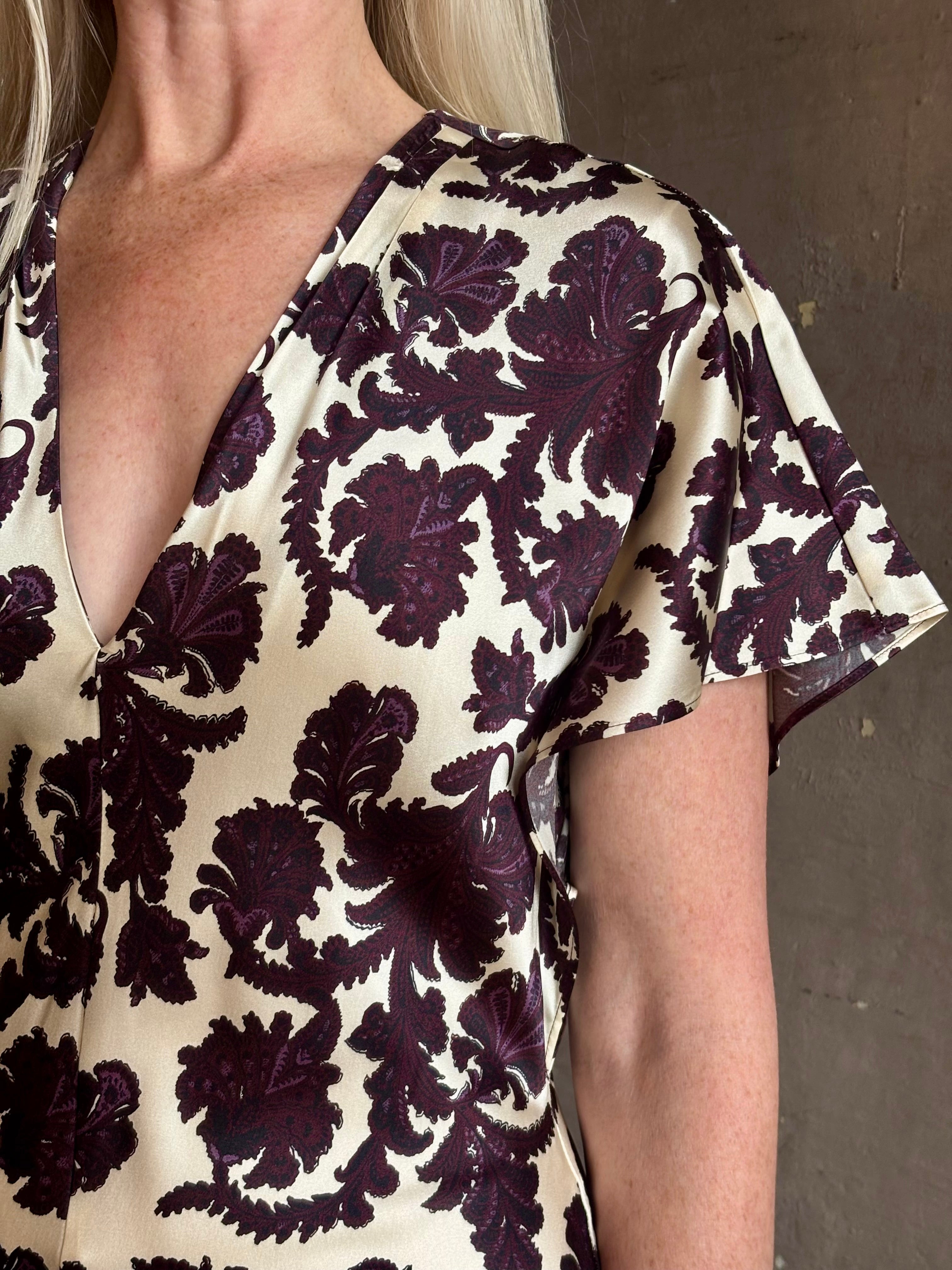 Mature woman wearing designer Veronica Beard V-Neck Redgrave Dress Ecru Multi short sleeves sheath maxi occasion-ready 