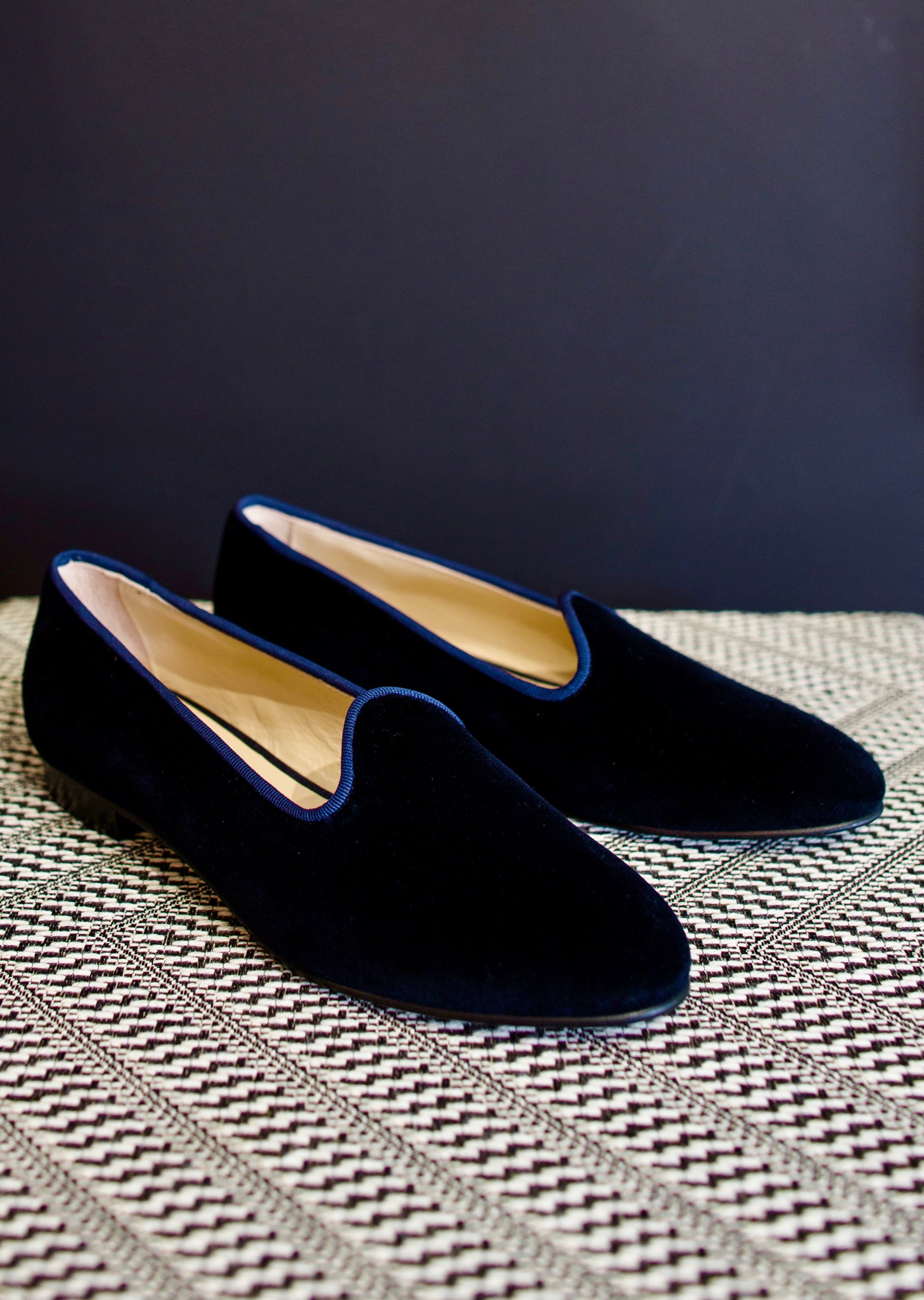 Image featuring blue velvet loafers by Vibi Venezia with an almond toe, grosgrain trim and a slip on fit. They have a leather sole.