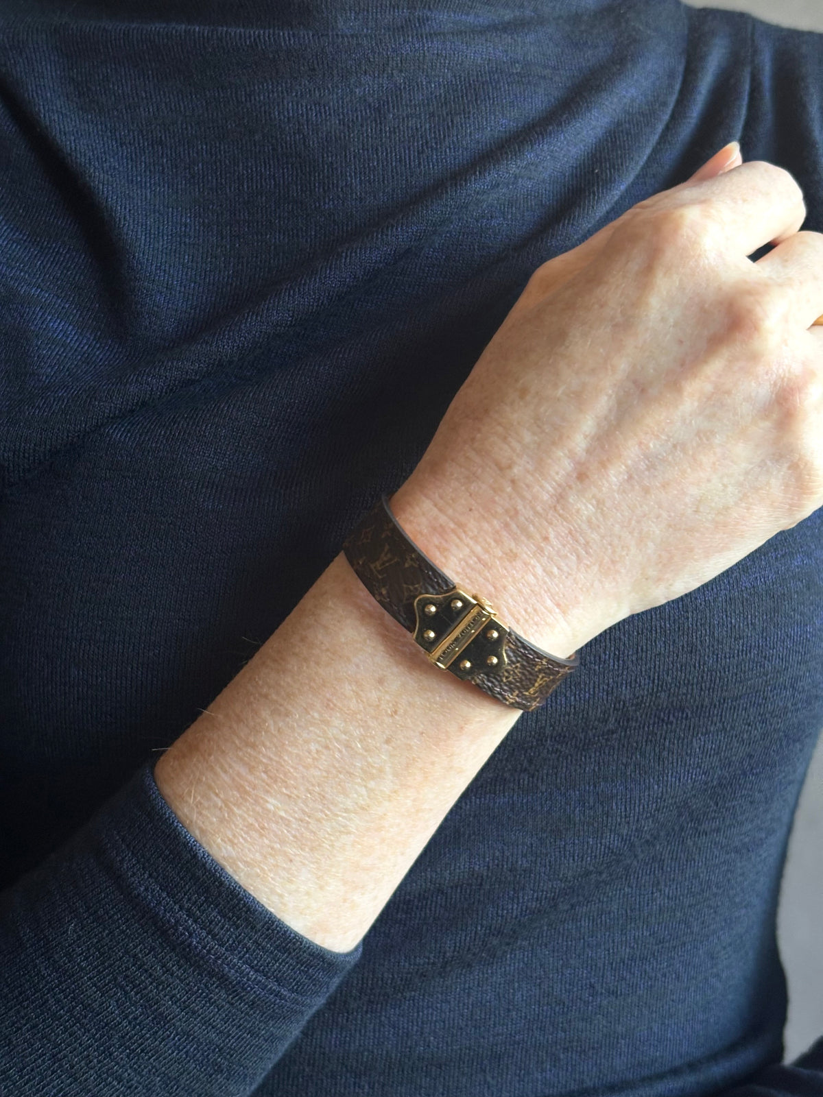 Louis Vuitton Spirit Nano Monogram Bracelet Monogram canvas engraved golden cylinder hinge closure Pre-owned