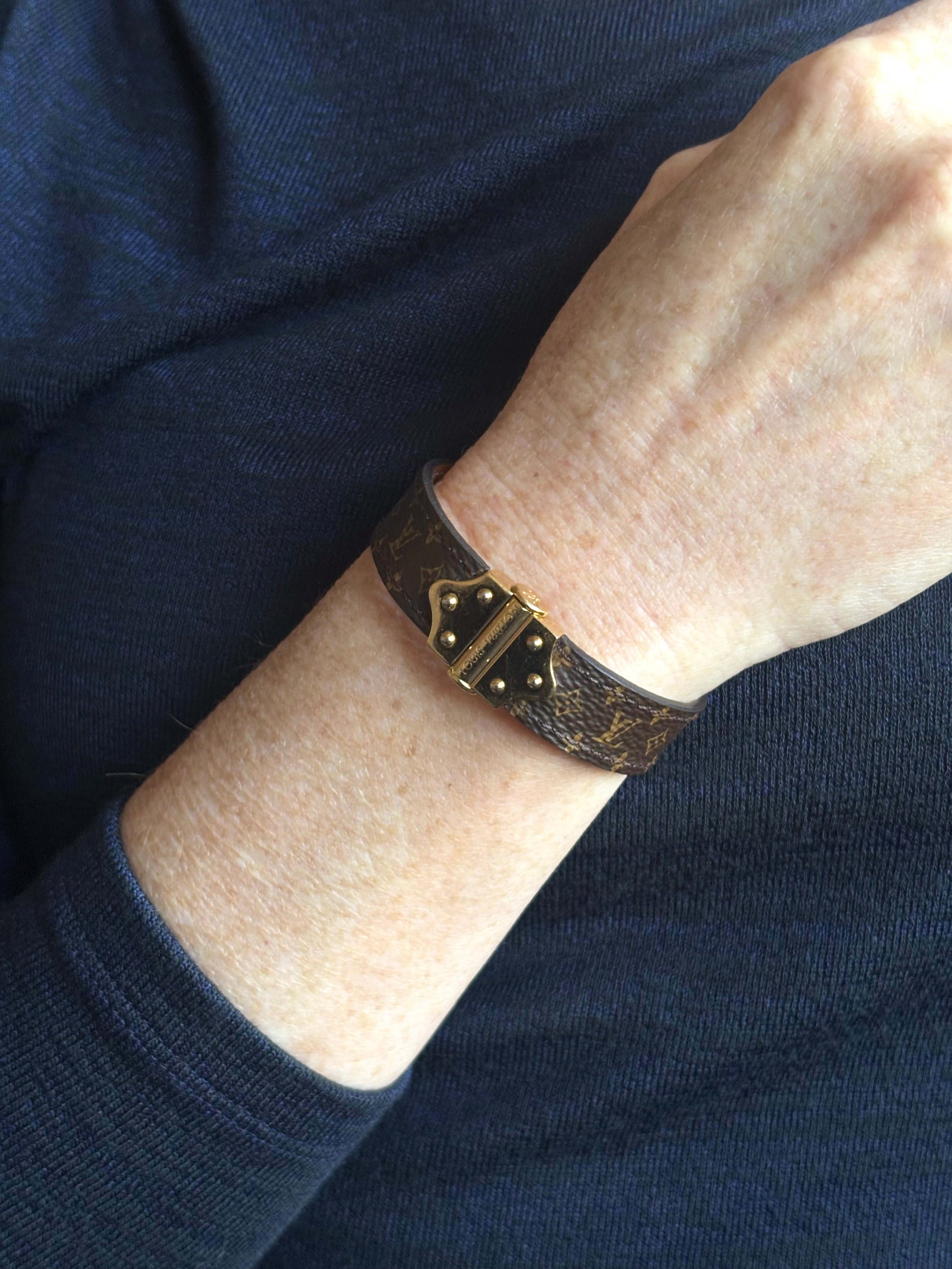 Louis Vuitton Spirit Nano Monogram Bracelet Monogram canvas engraved golden cylinder hinge closure Pre-owned
