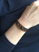 Louis Vuitton Spirit Nano Monogram Bracelet Monogram canvas engraved golden cylinder hinge closure Pre-owned