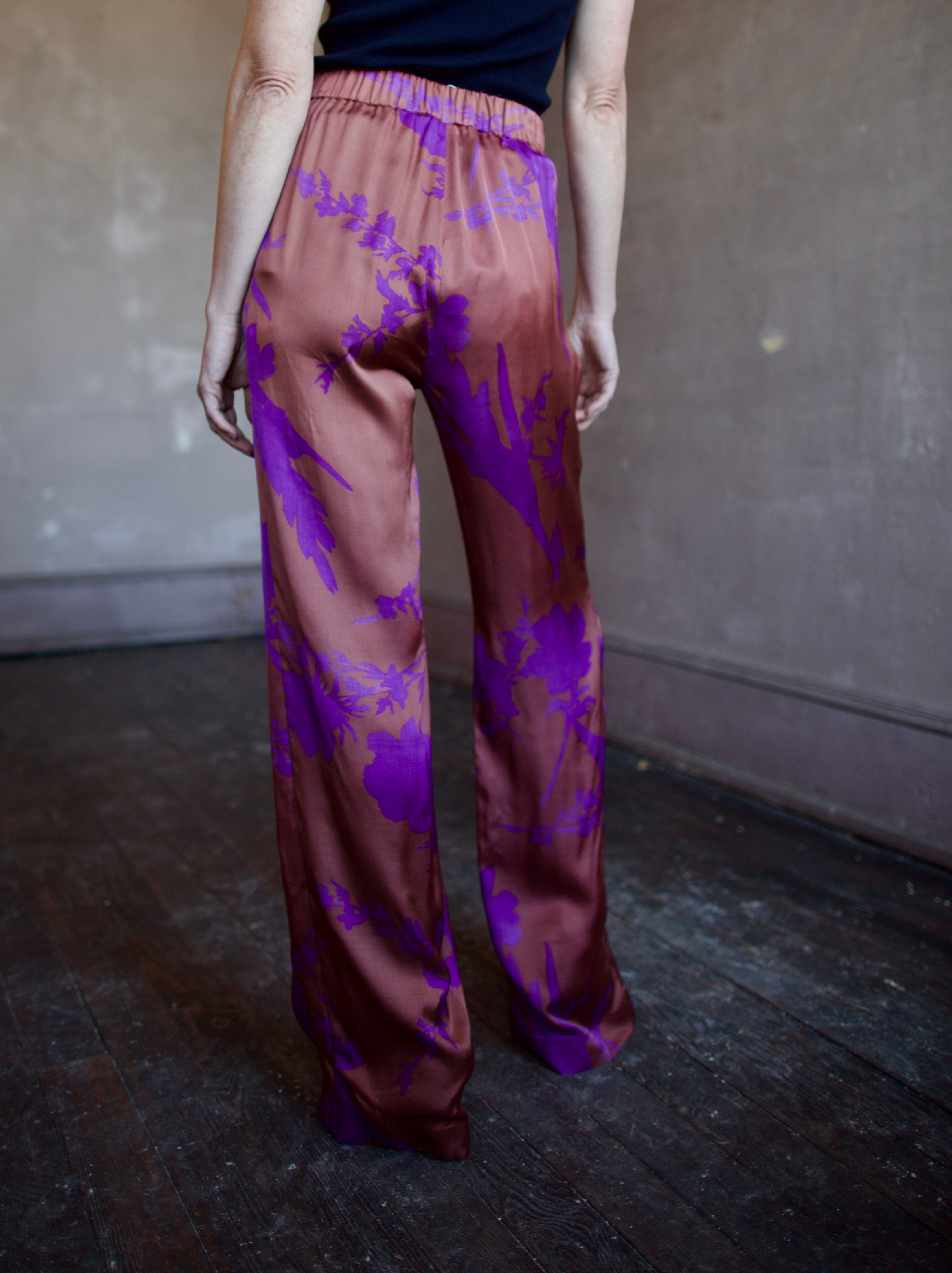 Image of woman wearing luxury brand Vanessa Bruno Cliff floral printed viscose pants features elastic waist, straight leg, side pockets and relaxed fit