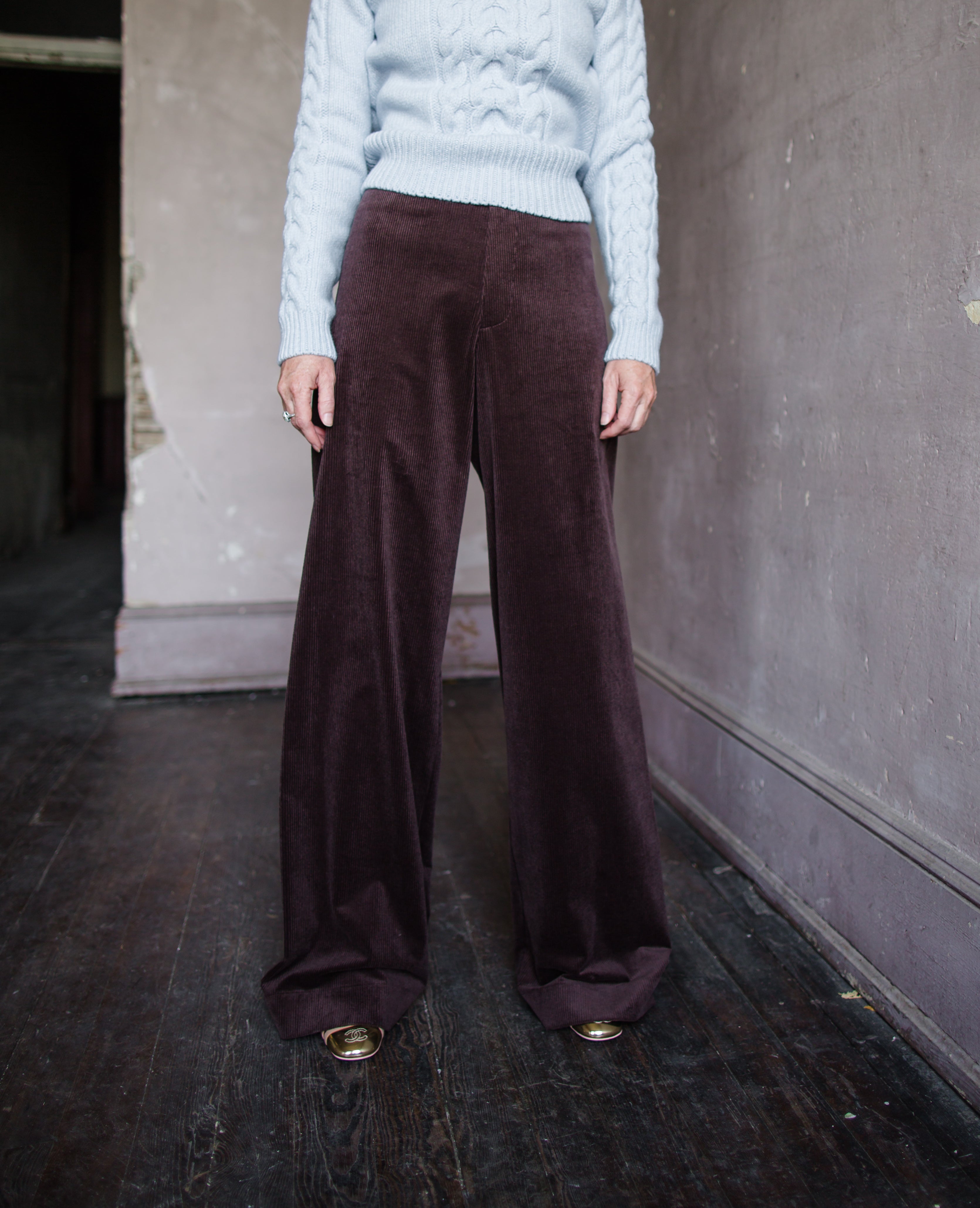 Image featuring a woman wearing the Dael cotton blend corduroy pants by Vanessa Bruno with a mid rise and wide leg in chocolate brown color.