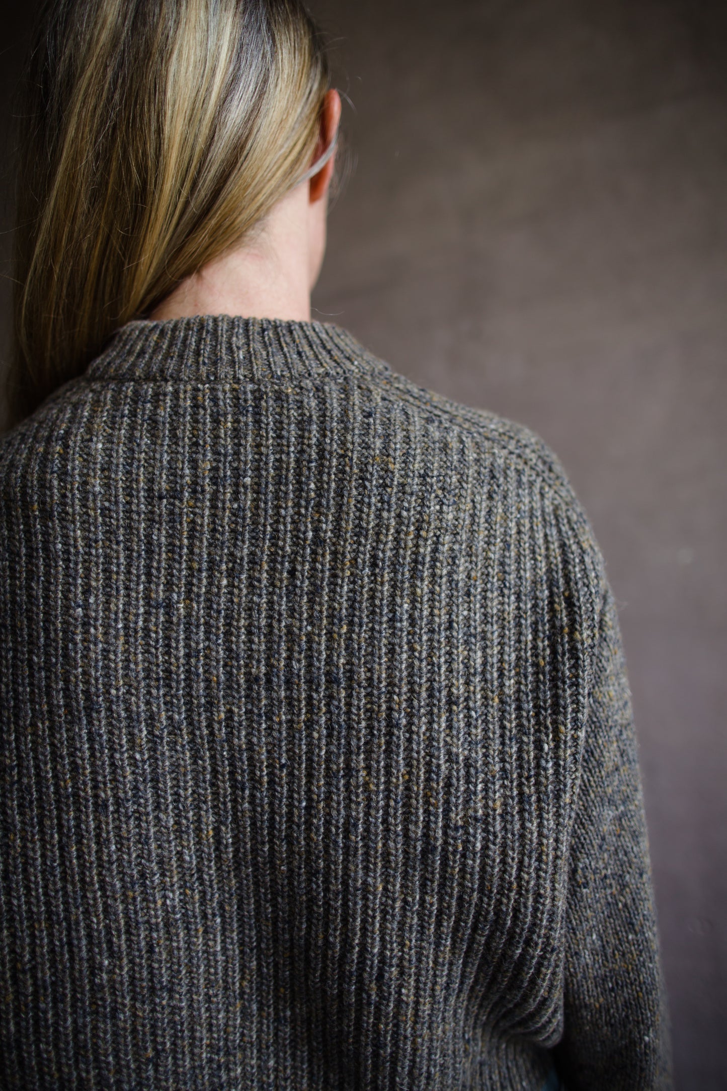 Back view of Woman wearing Vanessa Bruno Delora wool and alpaca cable knit sweater in taupe