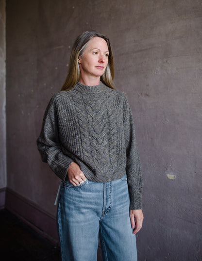 Woman wearing Vanessa Bruno Delora wool and alpaca cable knit sweater in taupe