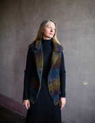 Woman wearing Vanessa Bruno dilda chunky knit vest in shade petrole merino wool blend