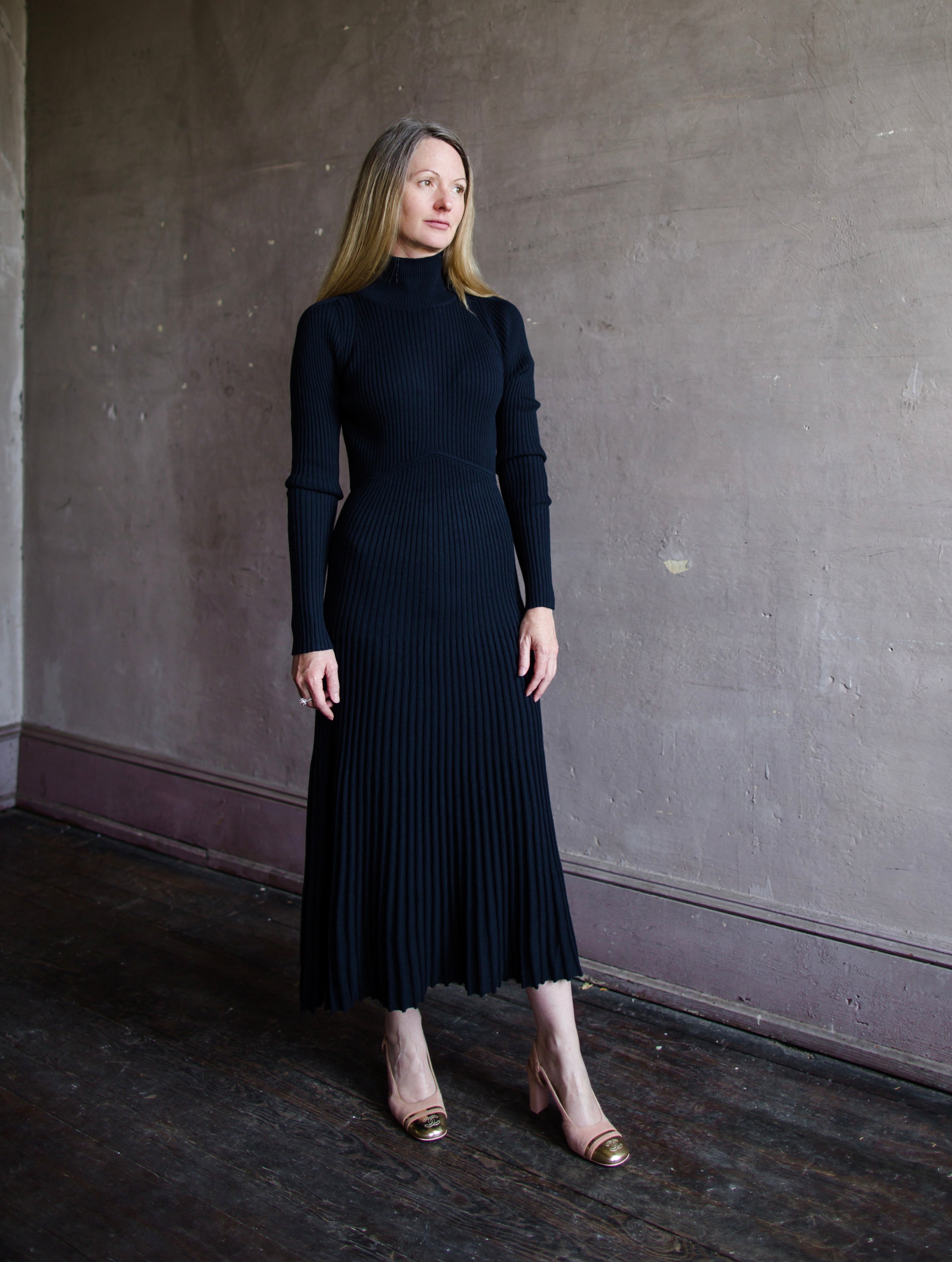 Woman wearing Vanessa Bruno Divana Ribbed knit dress in Navy wool cotton blend