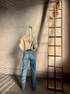 Back image of woman wearing Vanessa Bruno Benito jeans button and zip closure high rise straight leg full length medium wash