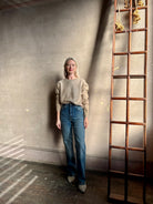 Mature woman wearing Vanessa Bruno's Benito Jean in Bleu Gris cotton-elastane denim high rise and straight leg Made in France
