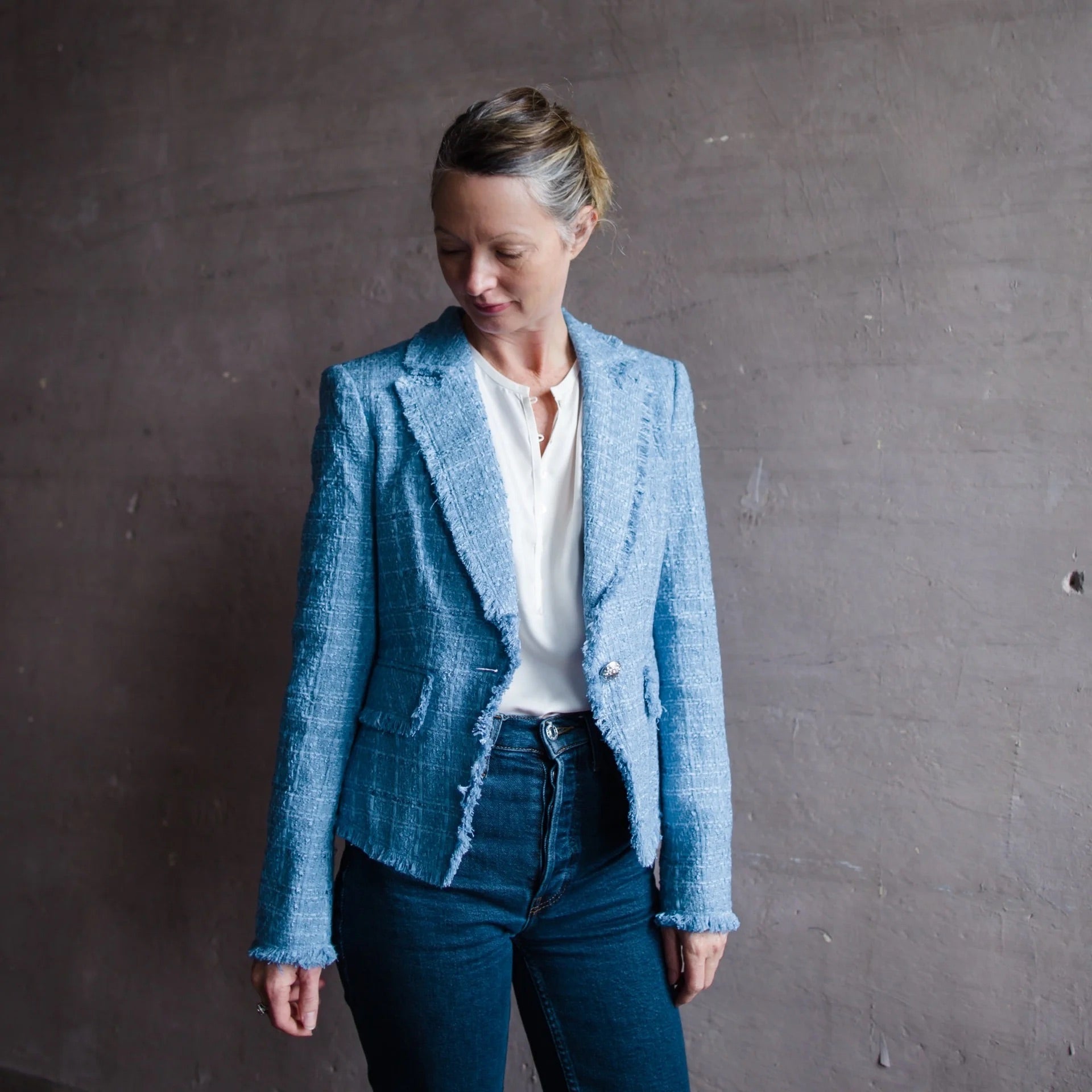 Image featuring a woman wearing the Veonica Beard Blue Hosanna Tweed Jacket in a brilliant blue.