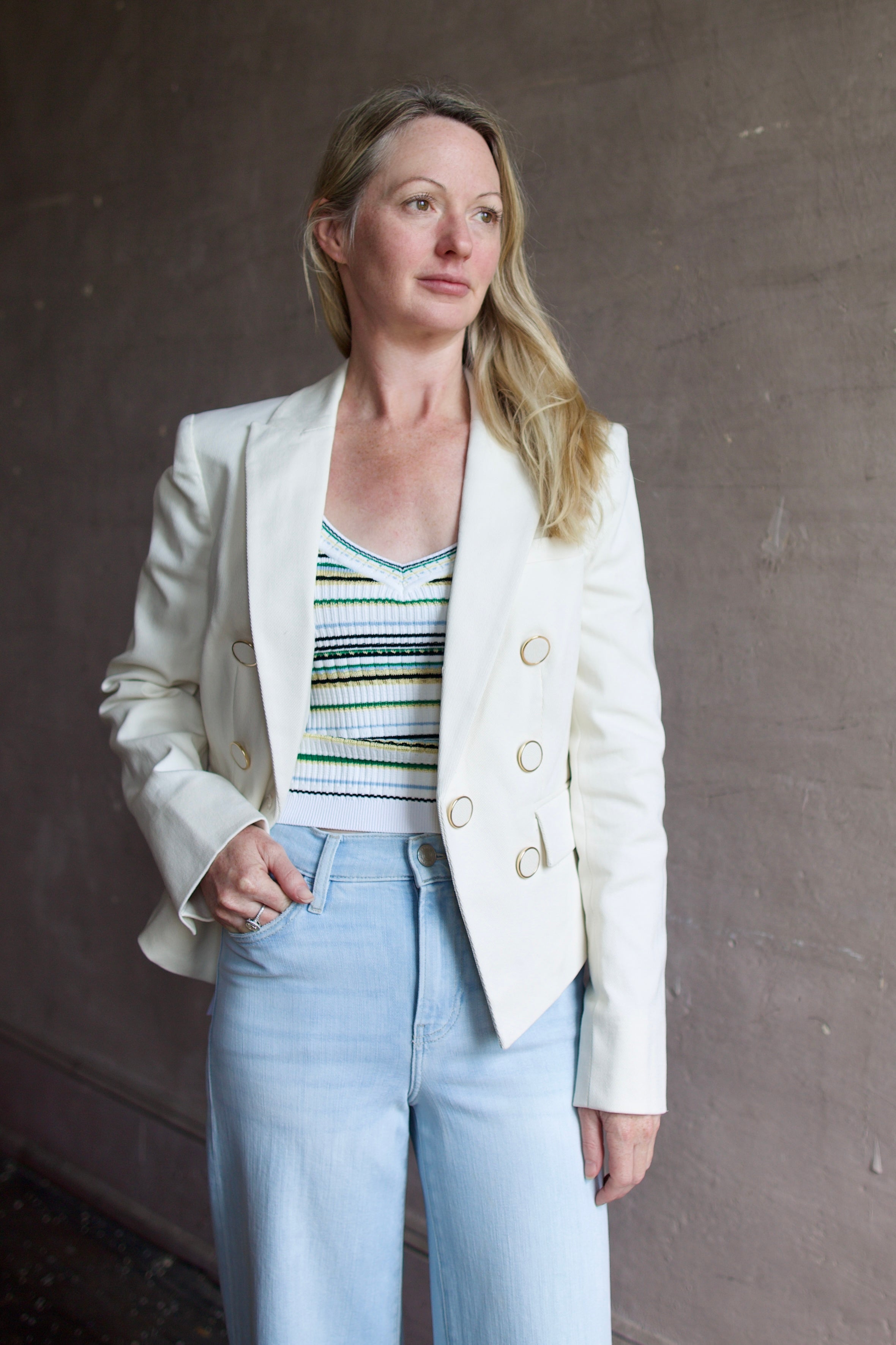 Model wearing the Veronica Beard Diego Jacket fabricated in premium cotton twill and subtle gold trimmed buttons for a refined tailored style