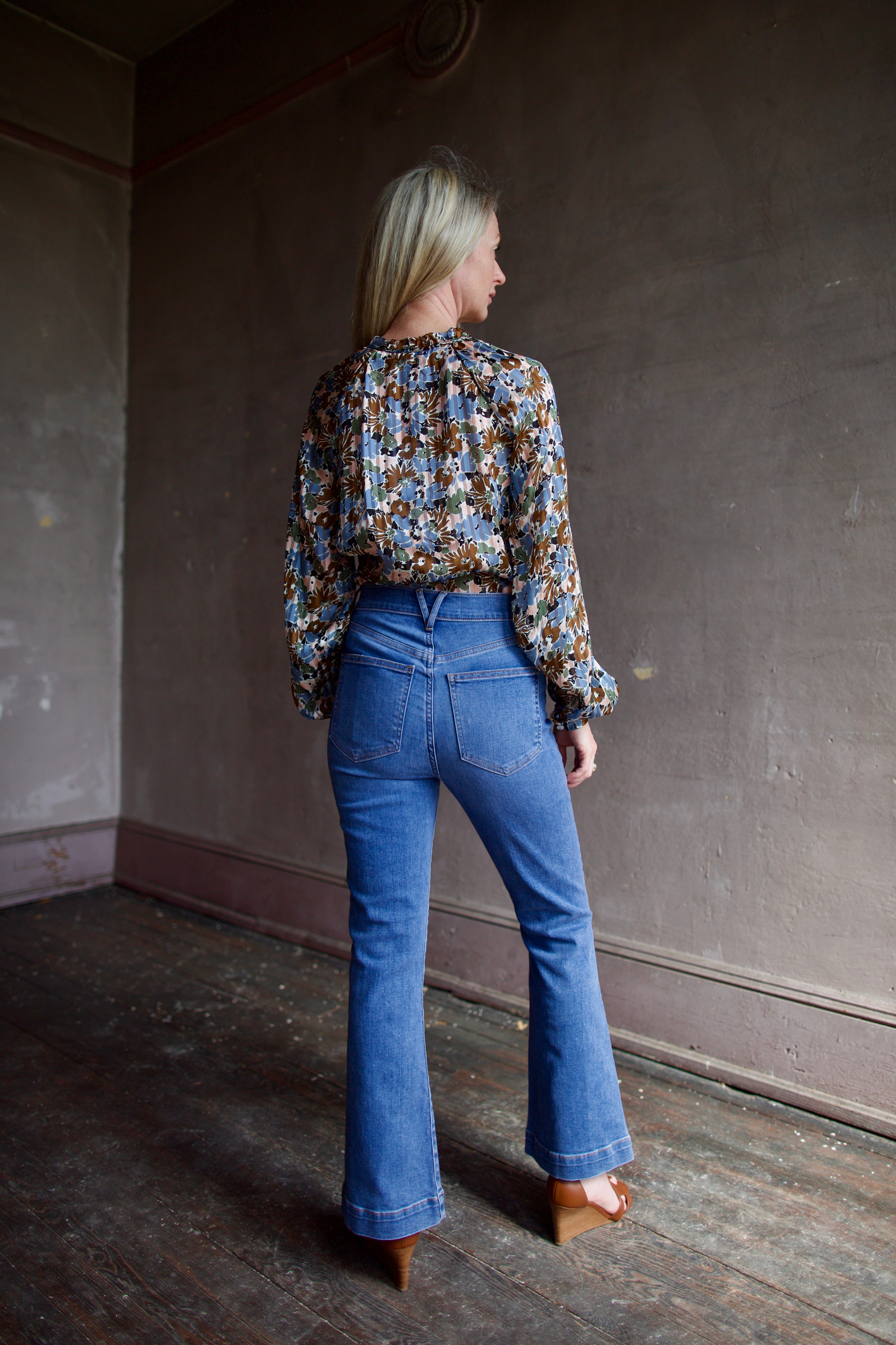 Model wearing the Veronica Bead Carson Ankle Flare Jeans in a contemporary modern design