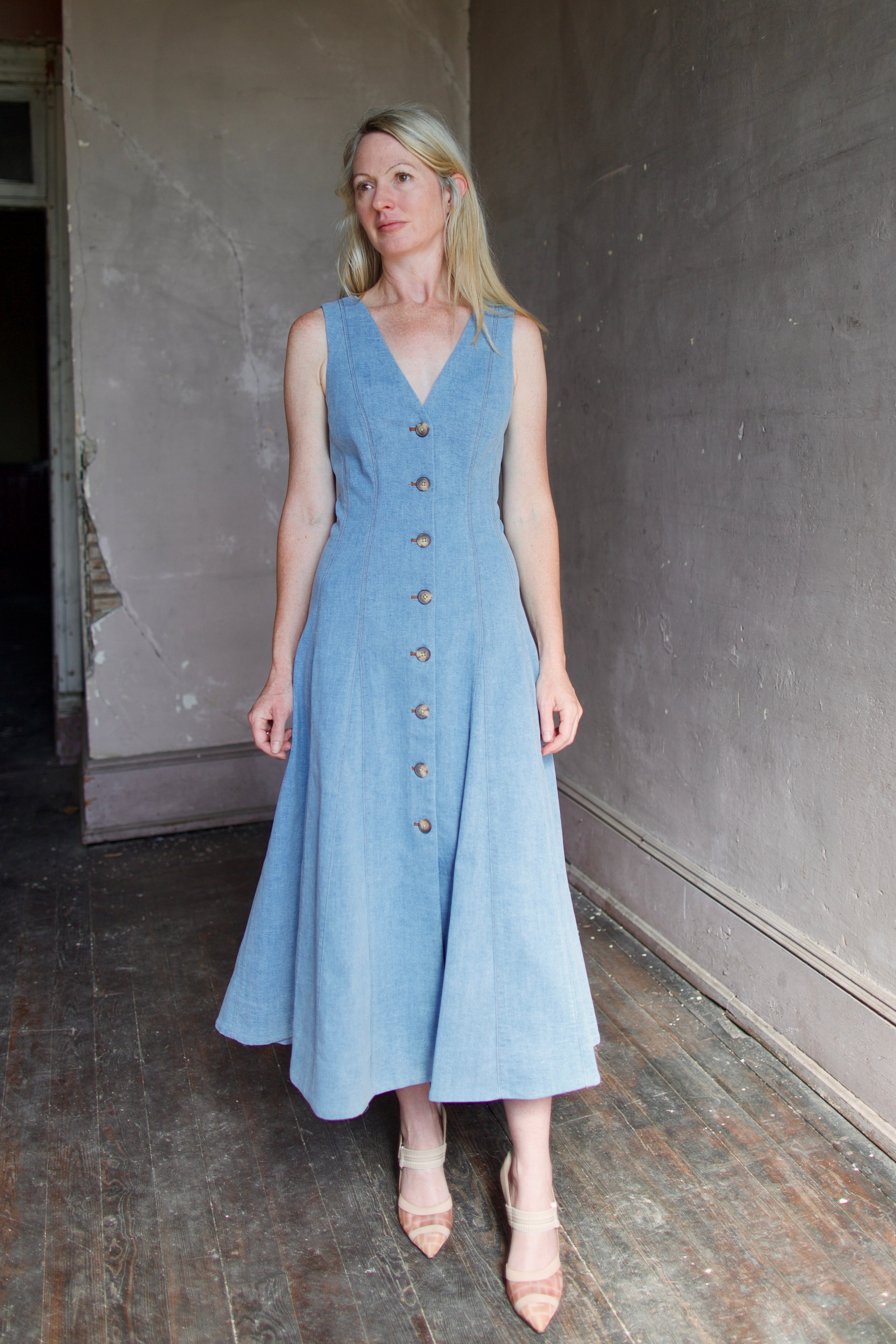 Model wearing Veronica Beard Lou Dress in blue mirage with quality thick chambray material for seamless feminine silhouette