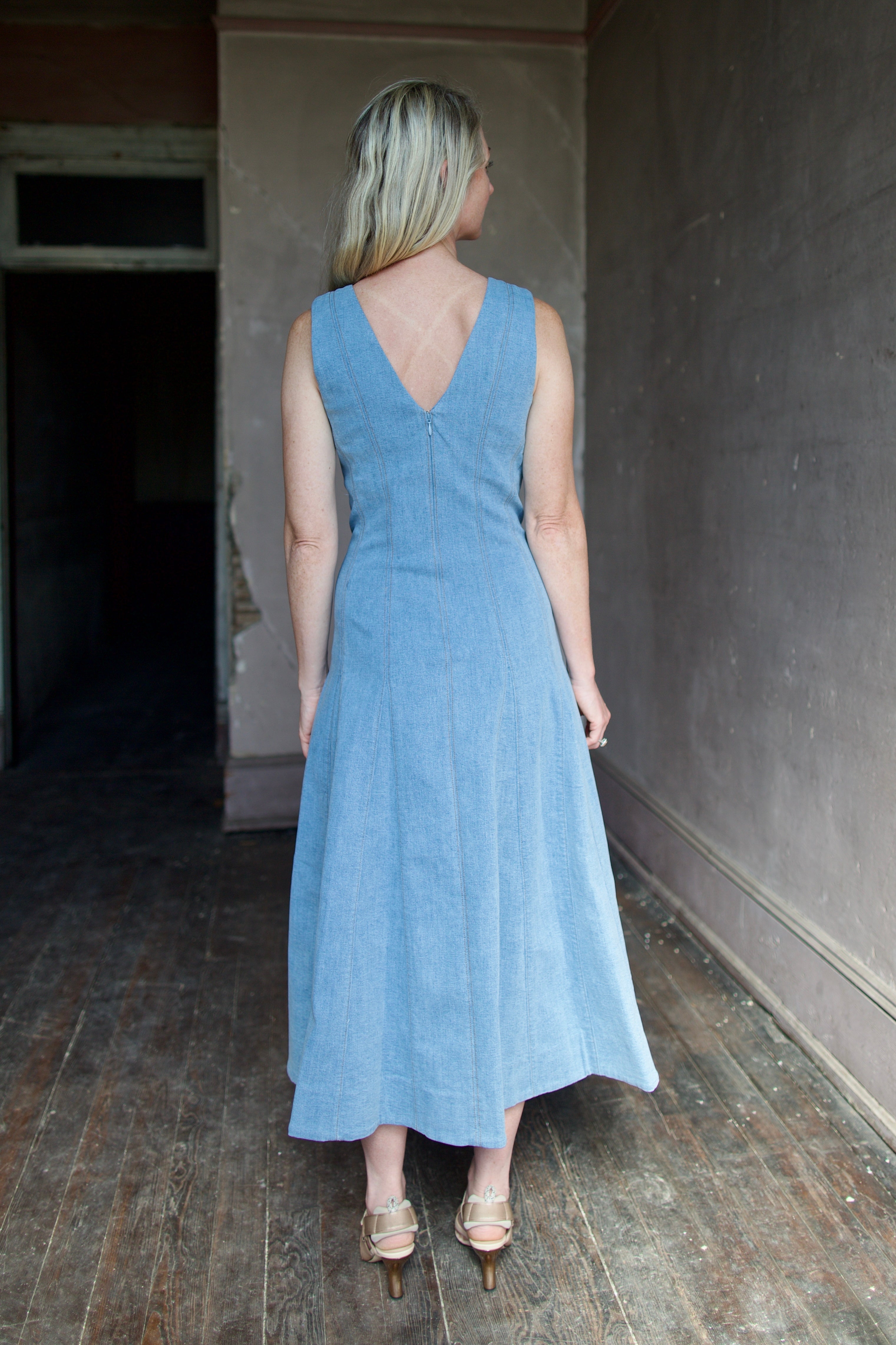 Model wearing Veronica Beard Lou Dress in blue mirage with discreet tailored v-back detail for a  feminine touch