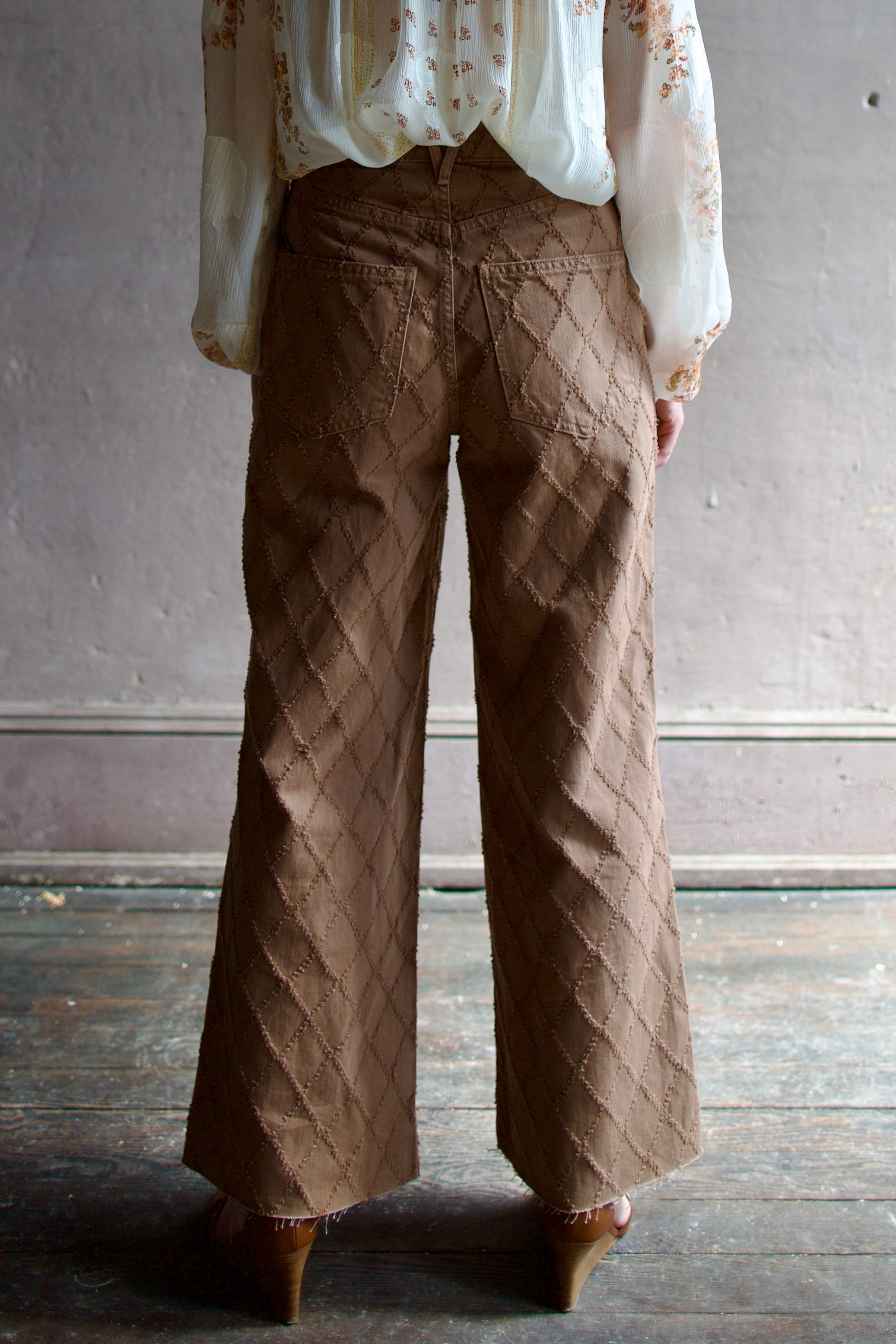 Model wearing the premium Veronica Beard Taylor Cropped Jeans in Hazelnut stone elevated neutral with sophisticated lattice texture