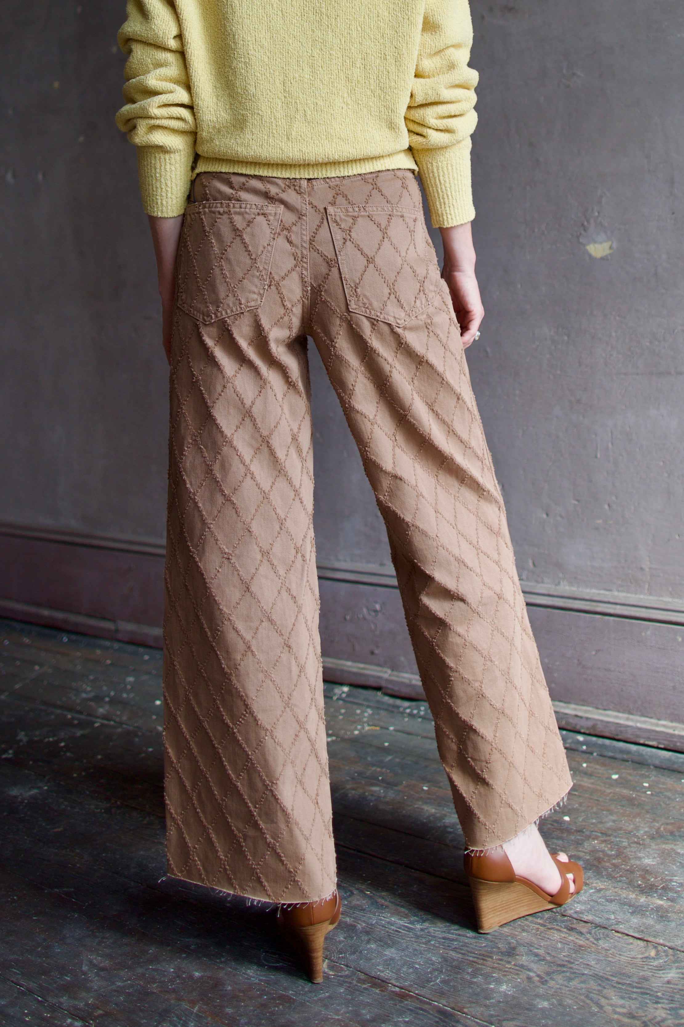 Model wearing the premium Veronica Beard Taylor Cropped Jeans in Hazelnut stone elevated neutral with sophisticated lattice texture