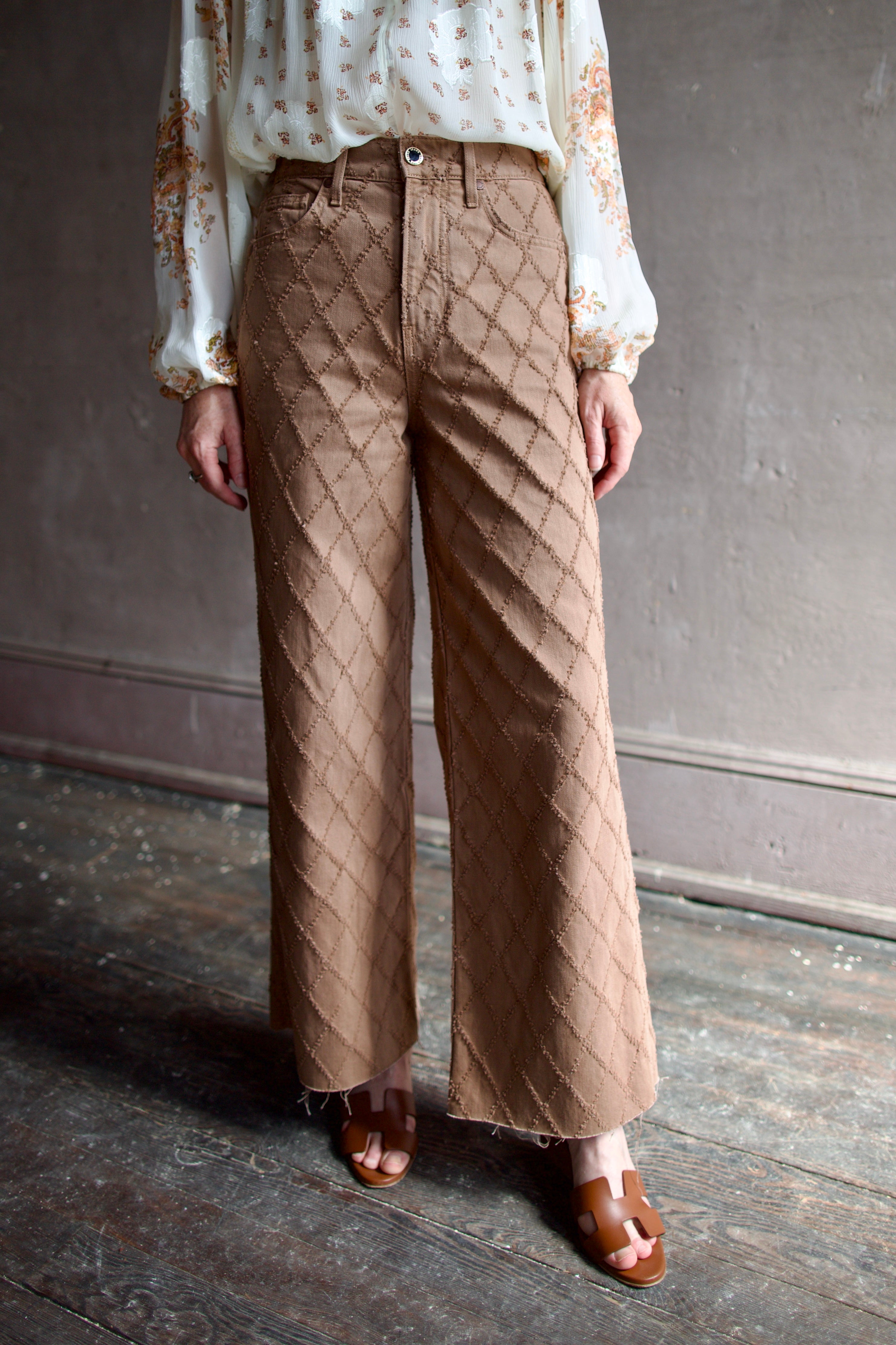 Model wearing the premium Veronica Beard Taylor Cropped Jeans in Hazelnut stone elevated neutral with sophisticated lattice texture