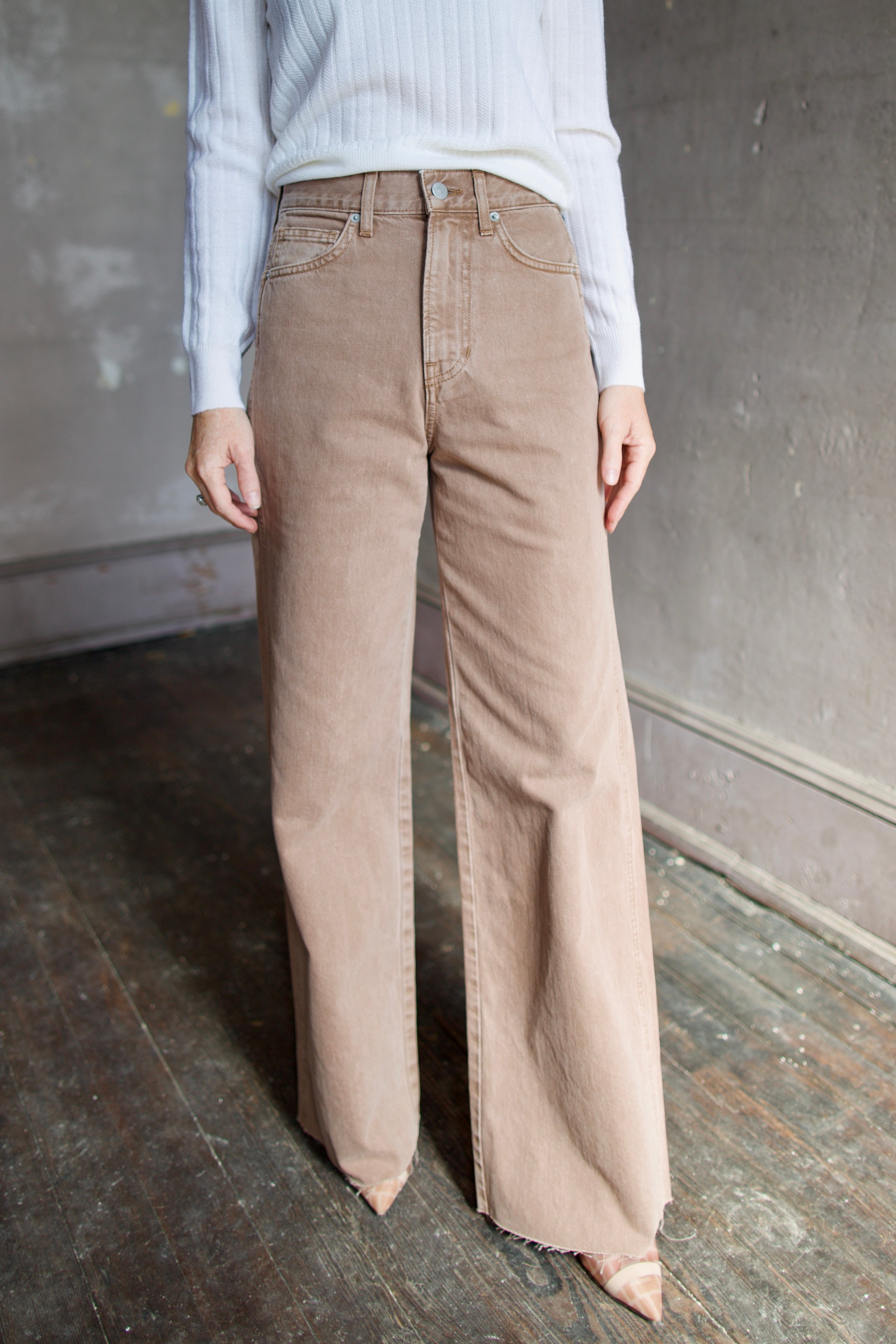 Model wearing a cream wool Cheval pullover and tan Taylor
high rise denim by contemporary designer Veronica Beard