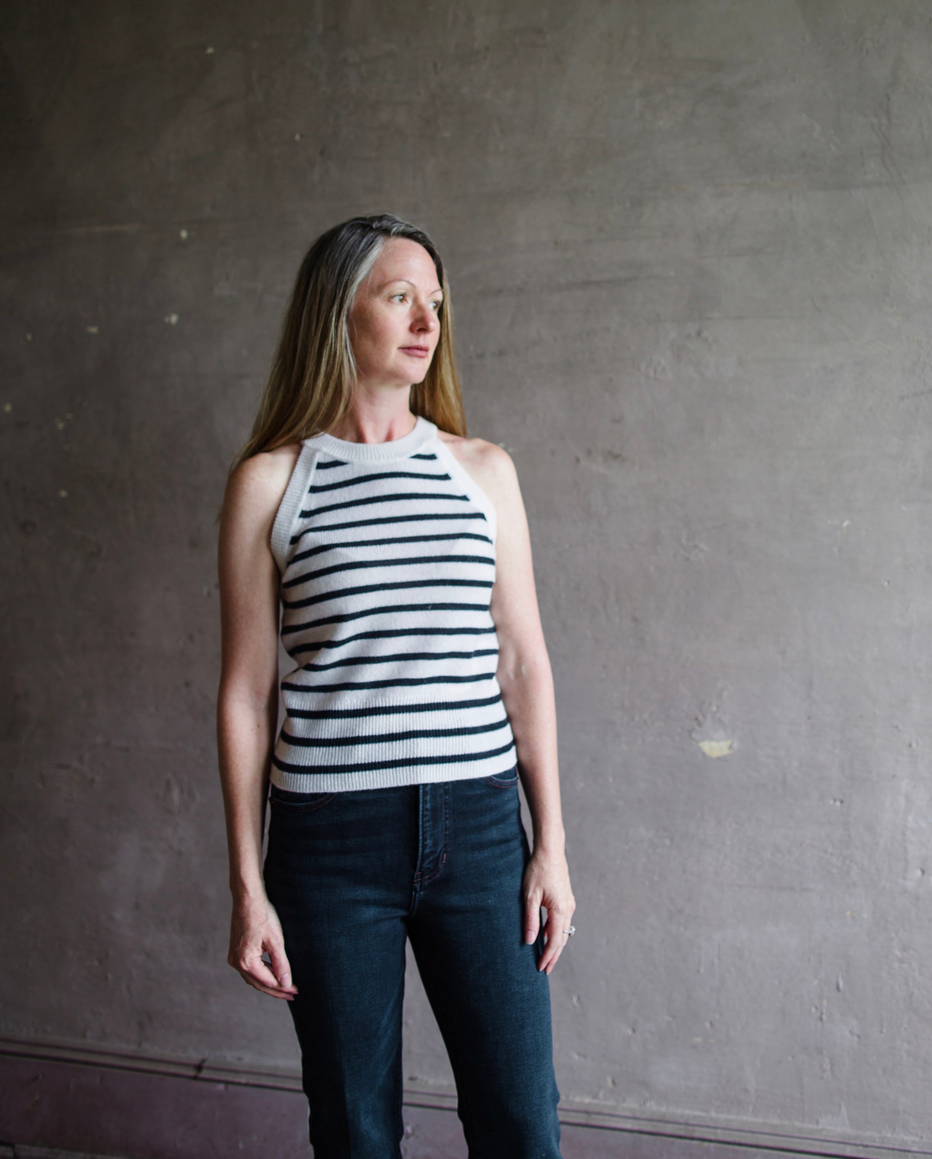 Mature woman wearing Veronica Beard Myrick sleeveless cashmere tank top crew neck Ivory and navy stripe 