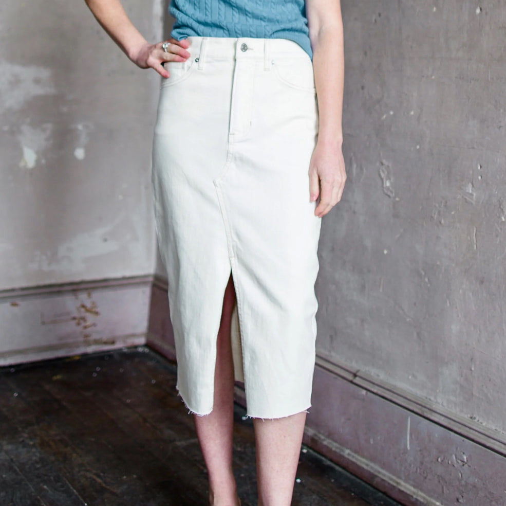 Image featuring a woman wearing  the Breves denim skirt by Veronica Beard in ecru color.