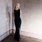 Image featuring a woman wearing the Veronica Beardd Kura Velvet Dress in dark navy blue.