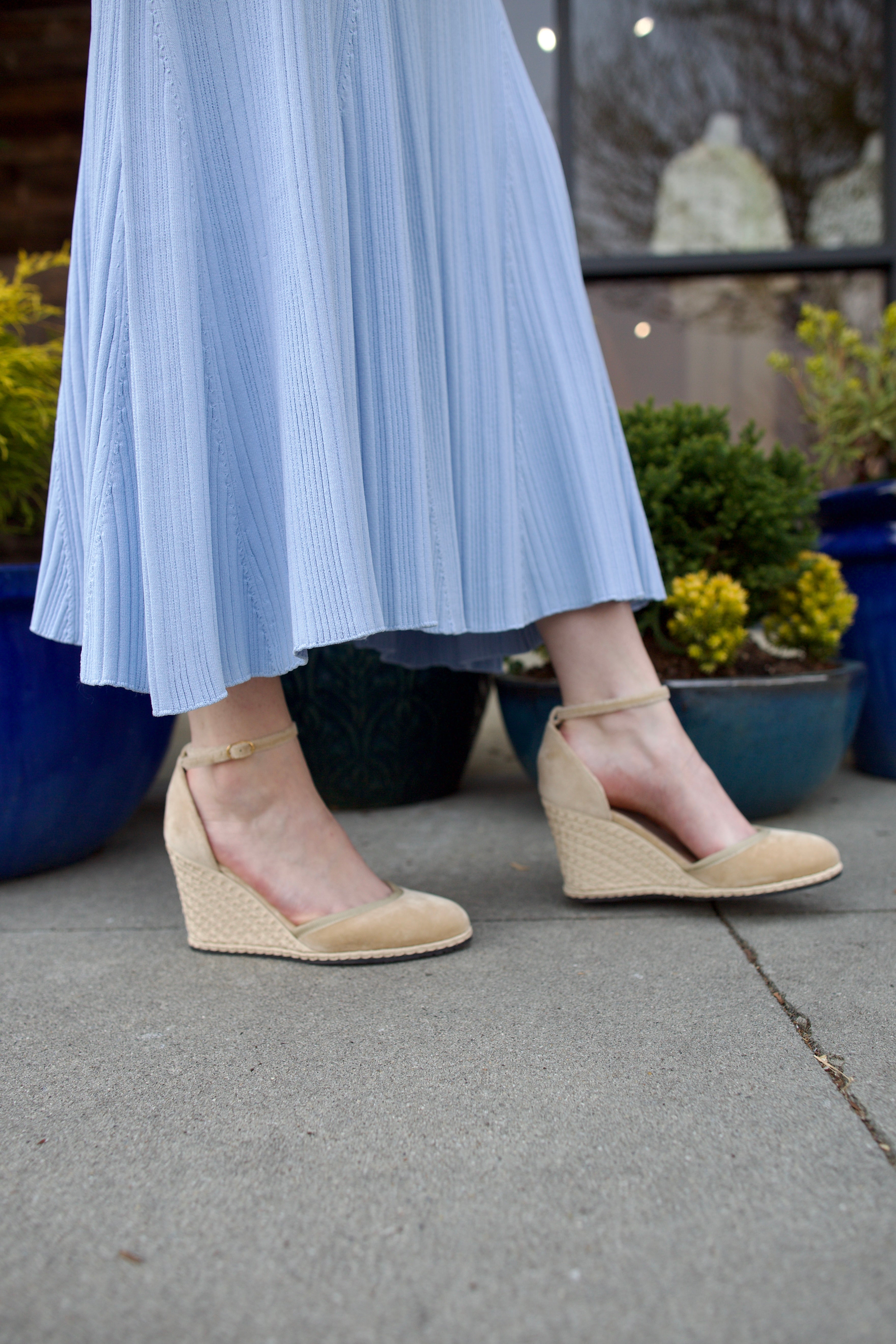 A pair of beige Vibi espadrille wedge heels in beautiful neutral velvet with ankle straps and buckle closures.