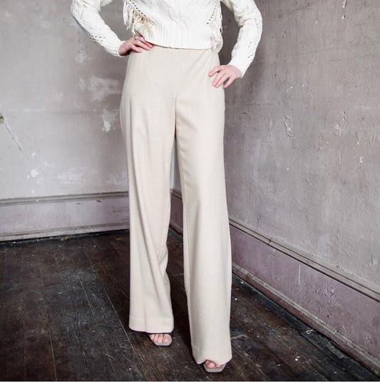 Image featuring a woman wearing  Italian brushed wool- blend flannel, straight leg pants from Vince in beige.