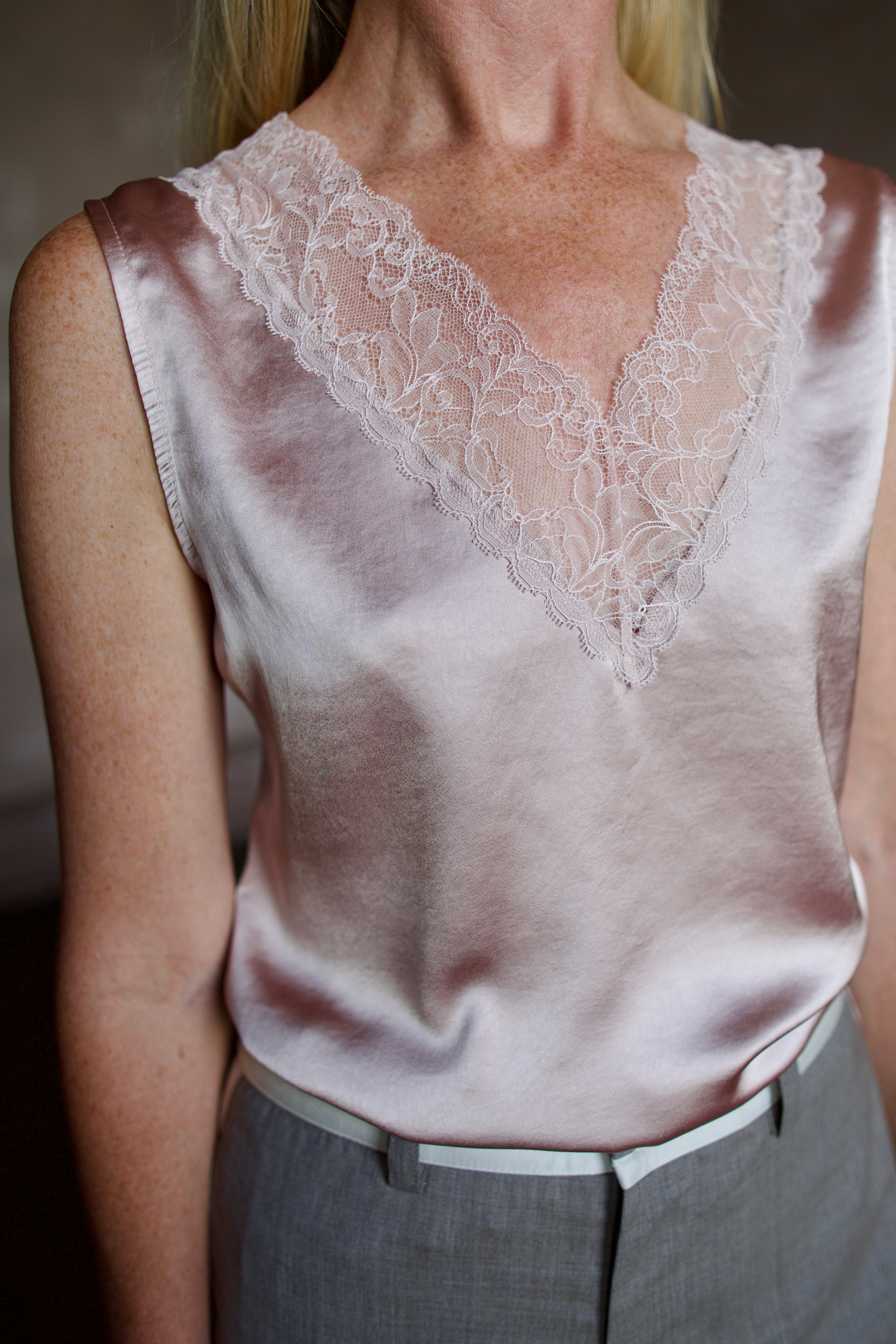 Mature model wearing a bra friendly camisole top with lace detailing at neckline by WE-R4 