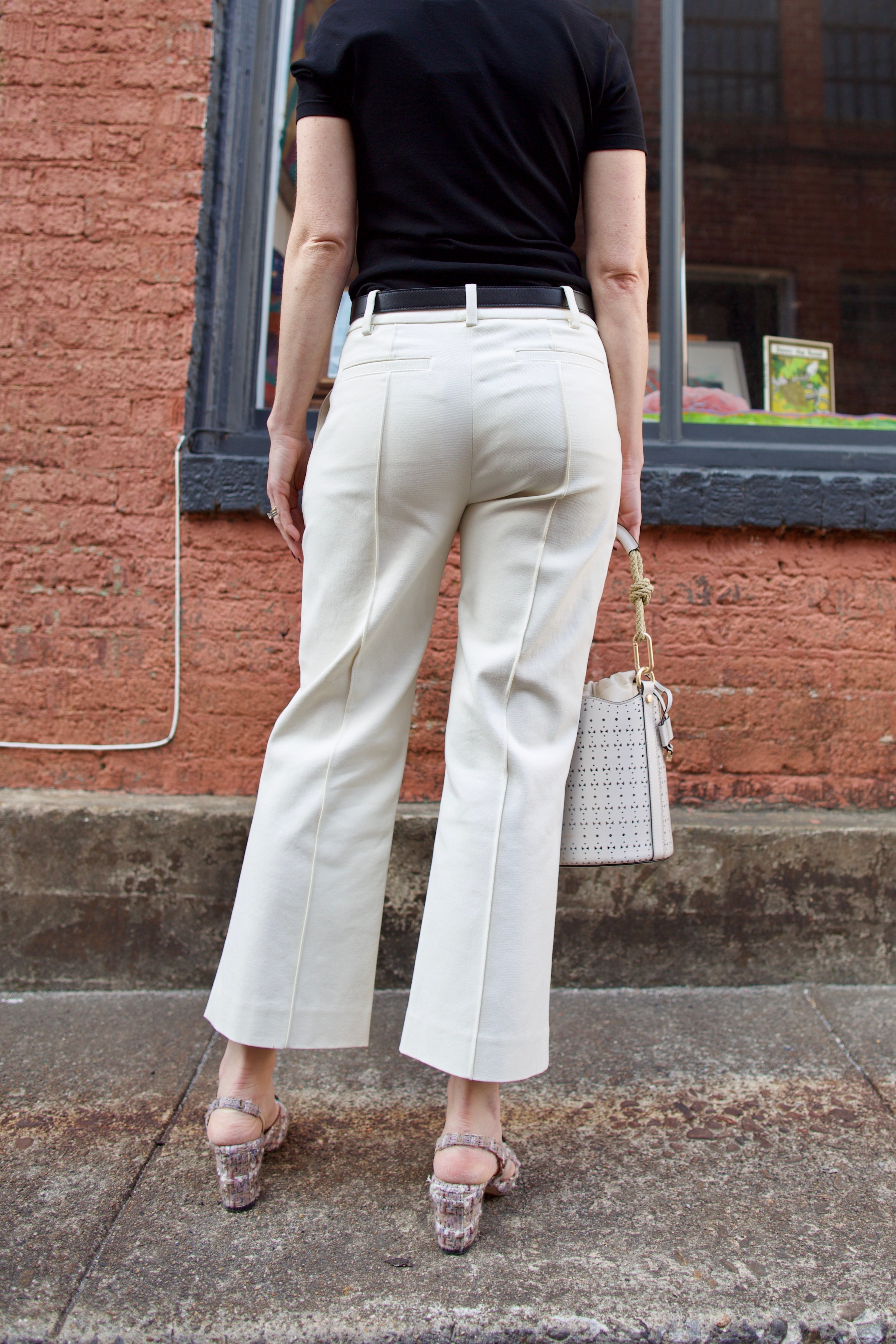 Mature women wearing luxury women's ALC Jay tailored trouser in cotton blend mid rise with straight, cropped leg and pintuck detailing